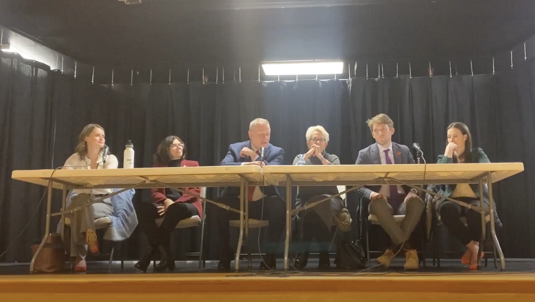 Six Utah legislators representing parts of Salt Lake County speak at a town hall event in Holladay on Wednesday. The group spent about 15 minutes answering questions from constituents about HB527, which was introduced earlier in the week.