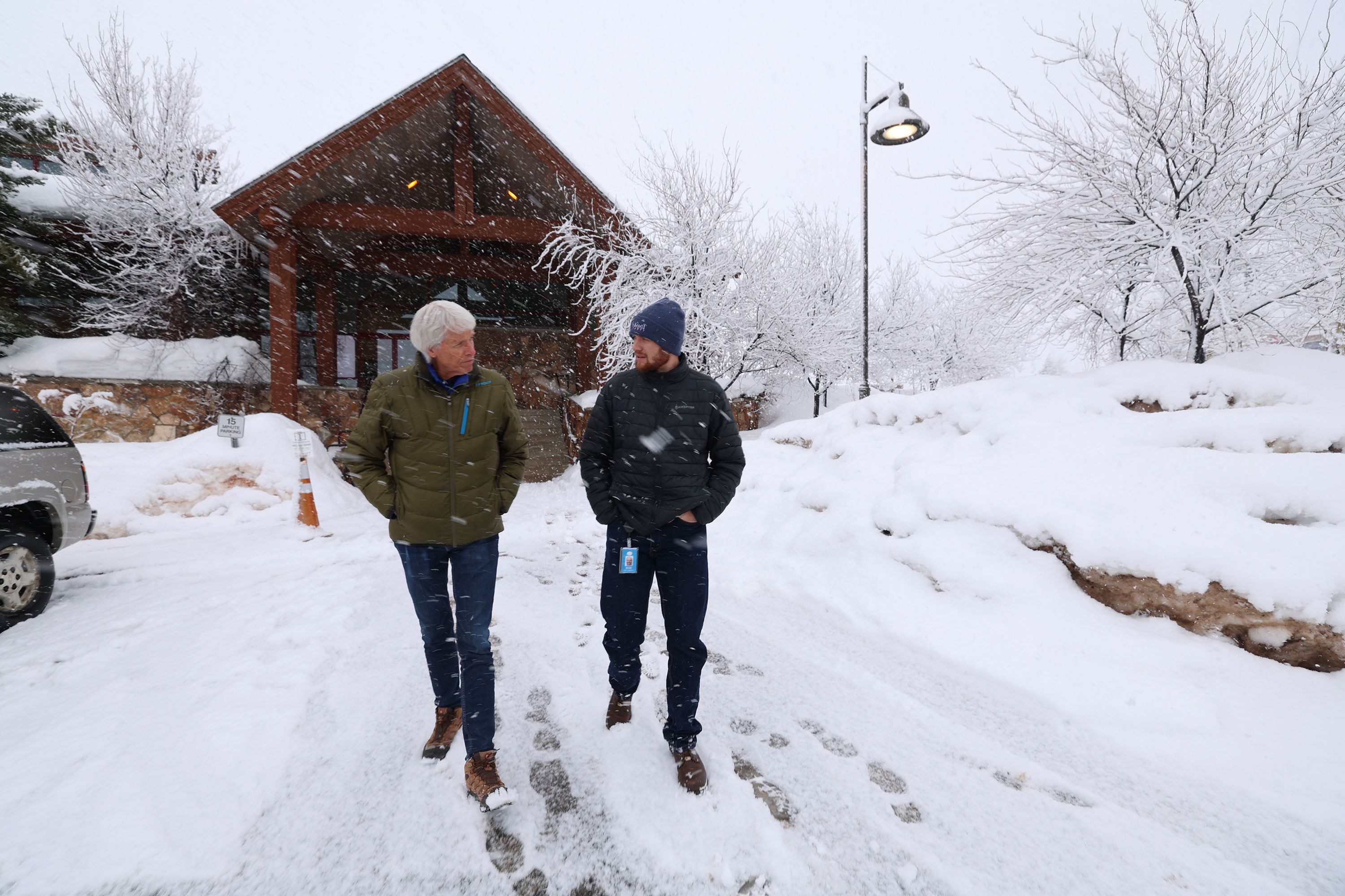 Summit County Councilman Roger Armstrong, left, and Derek Siddoway talk about the different low-income housing locations in Summit County on Tuesday.