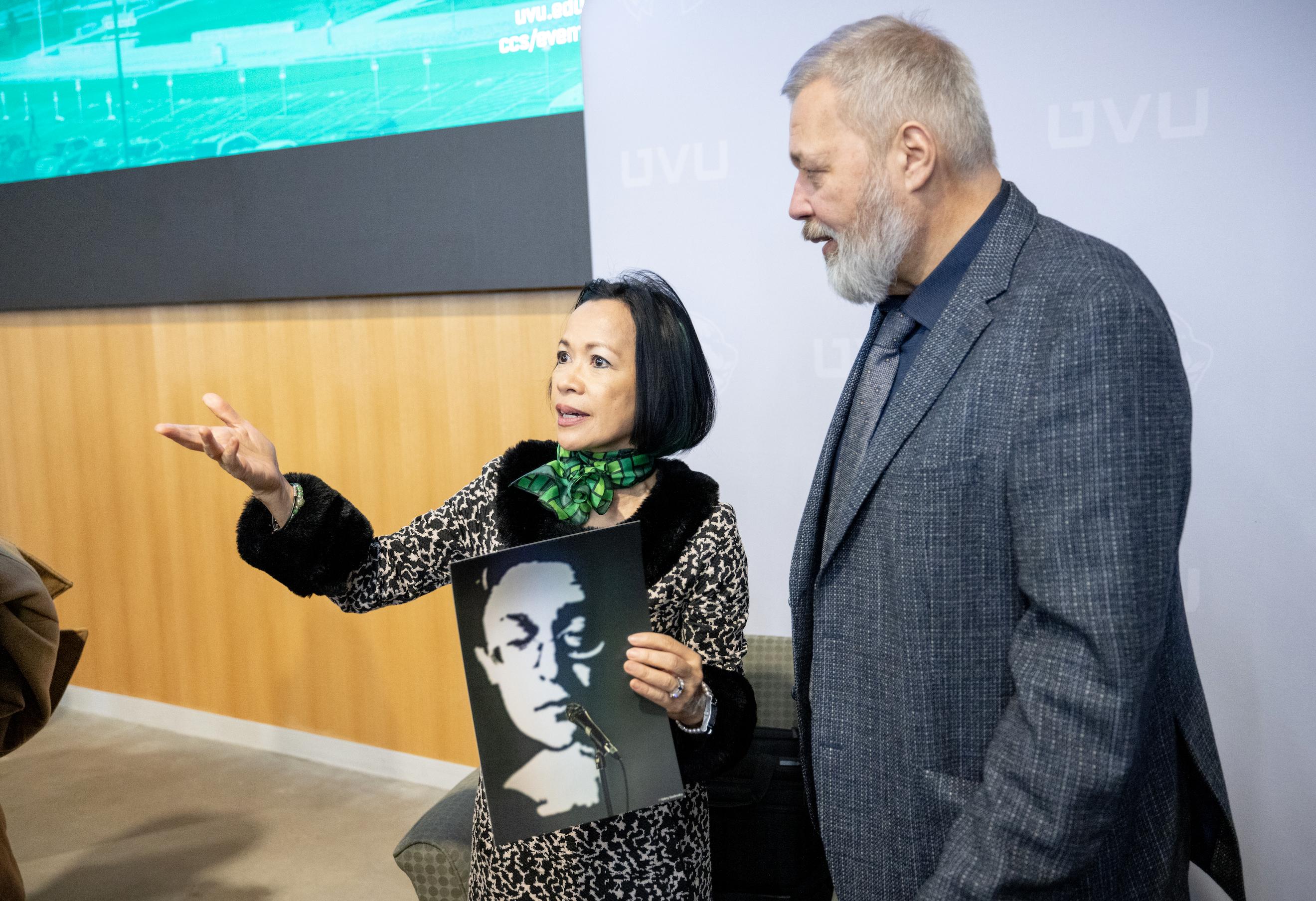 Utah Valley University President Astrid Tuminez holds a photo of Anna Politkovskaya given to her by Nobel laureate Dmitry Muratov, right, on Friday.