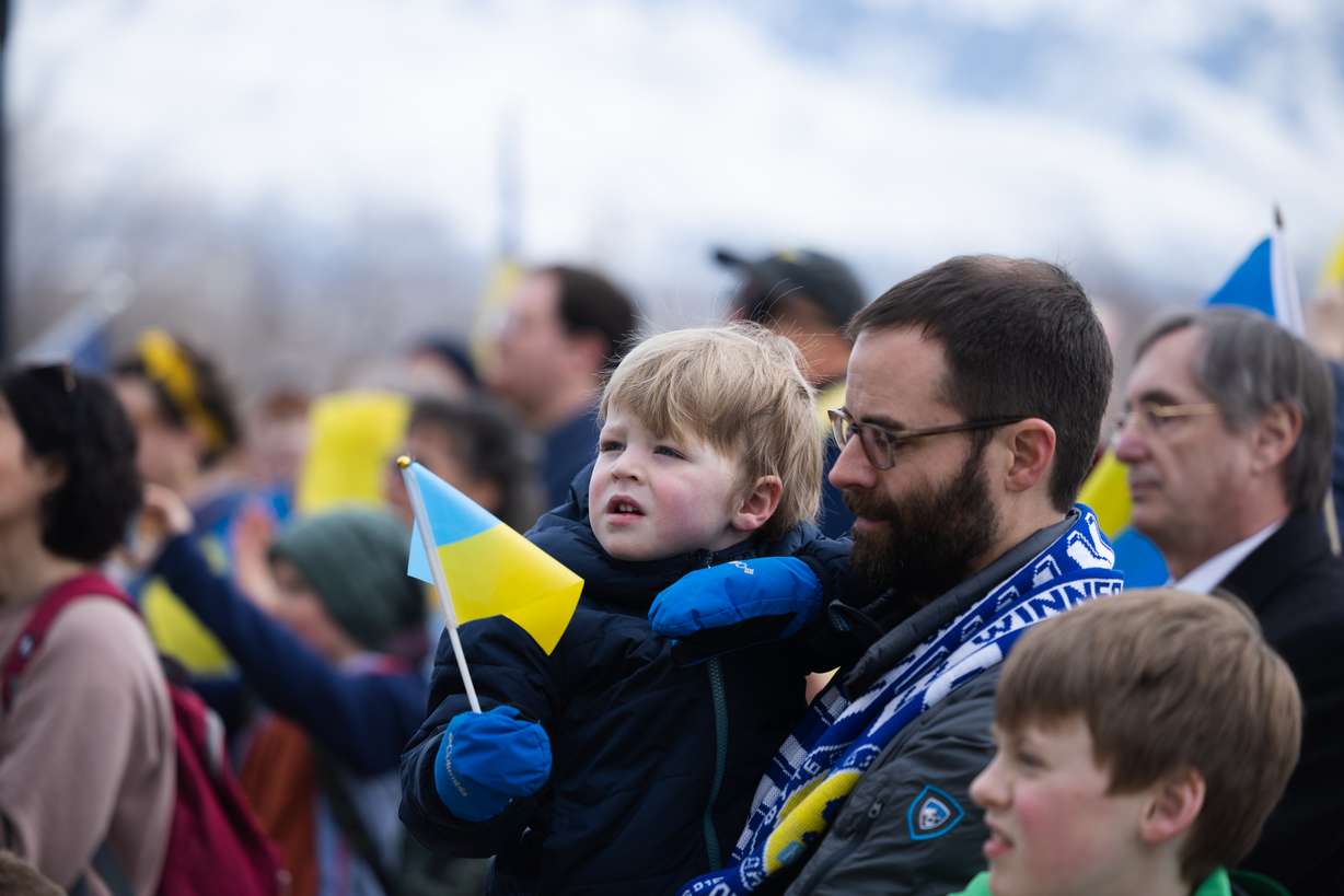 Taylor Turner holds his son Ben during a rally commemorating the one-year anniversary of the Ukraine-Russia war, at the state Capitol in Salt Lake City on Saturday.. Taylor was a missionary in Eastern Ukraine nearly two decades ago.