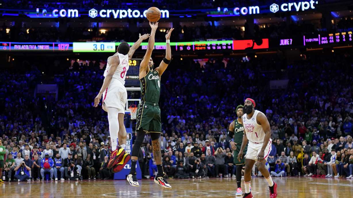 Boston Celtics' Jayson Tatum (0) goes up for the go-ahead shot against Philadelphia 76ers' De'Anthony Melton (8) during the final seconds of an NBA basketball game, Saturday, Feb. 25, 2023, in Philadelphia.