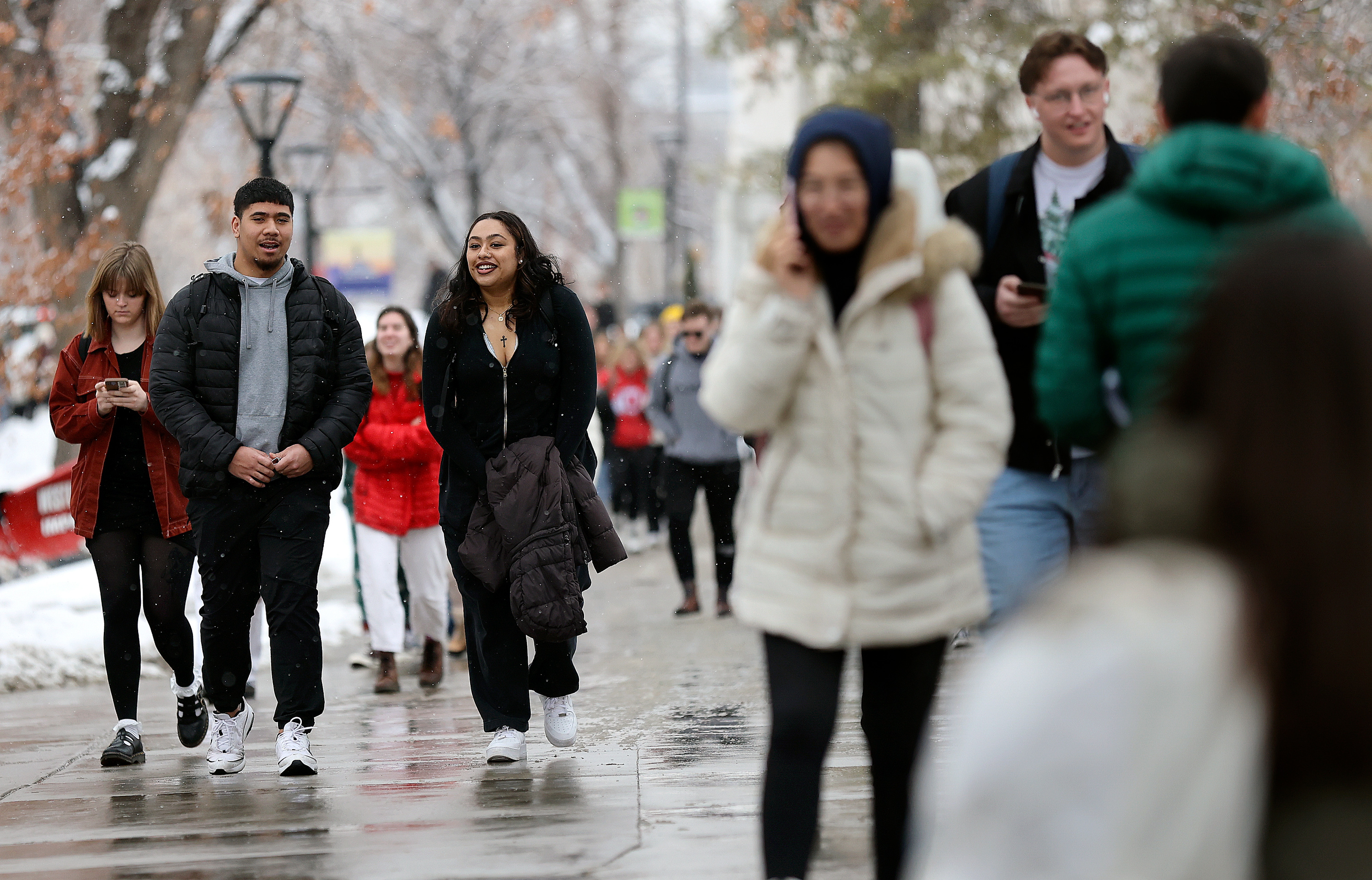 Marcus Lelauti and Char Niu walk through the University of Utah campus in Salt Lake City, on Feb. 6.
