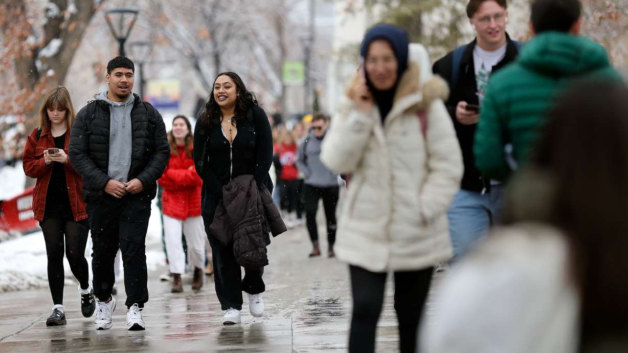Marcus Lelauti and Char Niu walk through the University of Utah campus in Salt Lake City, on Feb. 6.