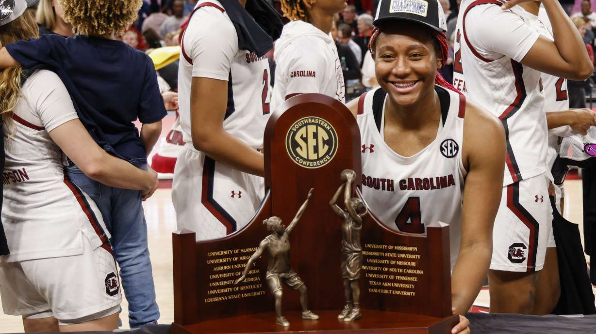 South Carolina forward Aliyah Boston stands with the SEC regular season trophy after South Carolina defeated Georgia 73-63 in an NCAA college basketball game in Columbia, S.C., Sunday, Feb. 26, 2023.