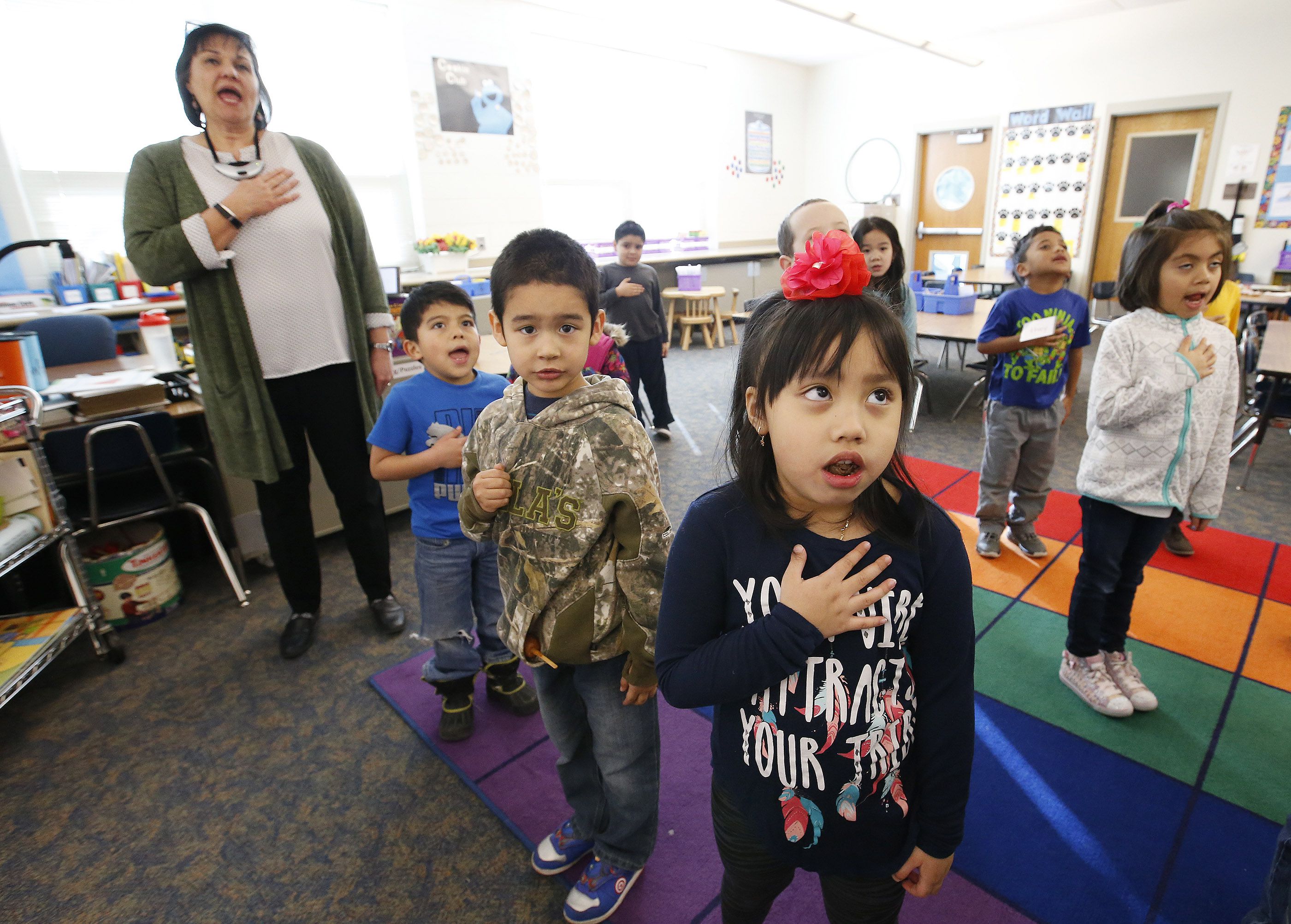 Julie Folsom, a teacher at Granger Elementary School, recites the Pledge of Allegiance with her students, including Tuyen Doam, in West Valley City on Feb. 15, 2017. A state lawmaker is sponsoring a resolution to further promote reciting the Pledge of Allegiance in public schools.