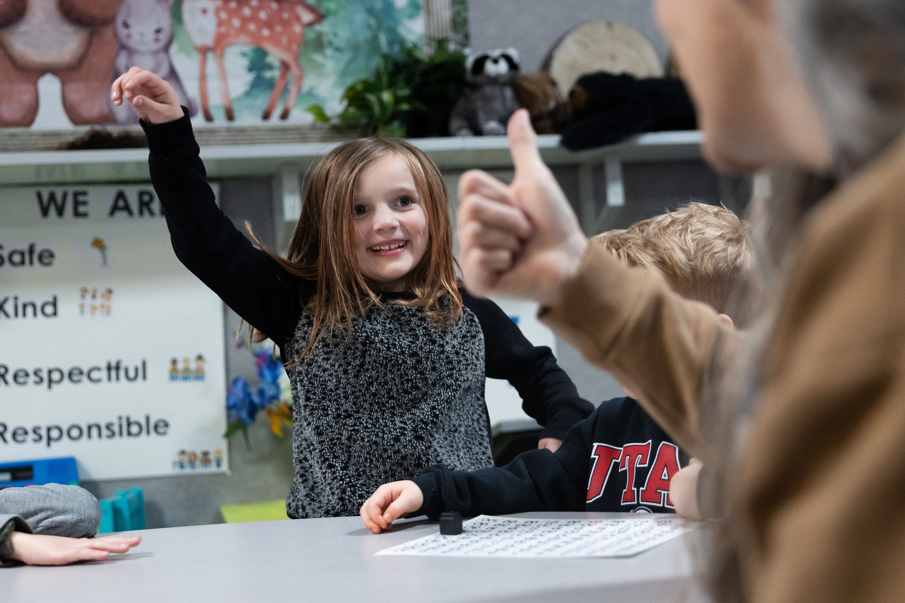 River McIver celebrates after answering correctly during a full-day kindergarten class at East Sandy Elementary School in Sandy on Monday. Educational research supports the benefits of all-day kindergarten and parents are increasingly demanding it, says one school administrator.