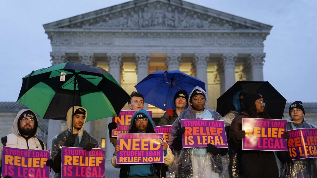 Student debt relief advocates gather outside the Supreme Court on Capitol Hill in Washington, Monday, ahead of arguments over President Joe Biden's student debt relief plan on Tuesday.