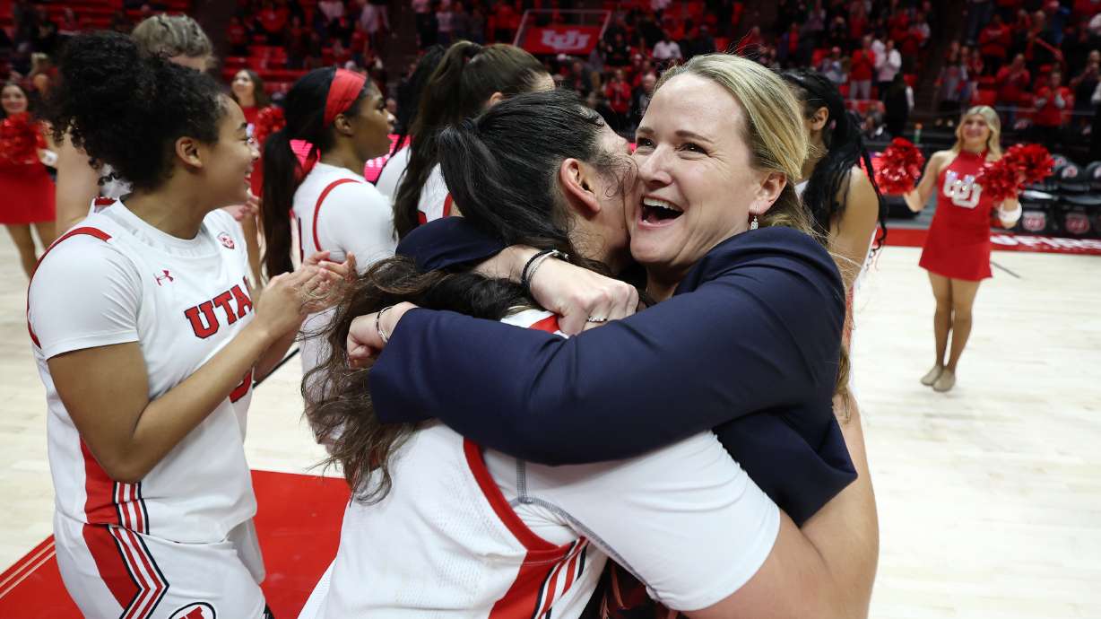 Utah Utes forward Alissa Pili (35) and coach Lynne Roberts celebrate as the University of Utah’s 10th-ranked women’s basketball team defeats the 14th-ranked Arizona Wildcats 80-79 in a thriller at the Huntsman Center in Salt Lake City on Sunday, Jan. 15, 2023.