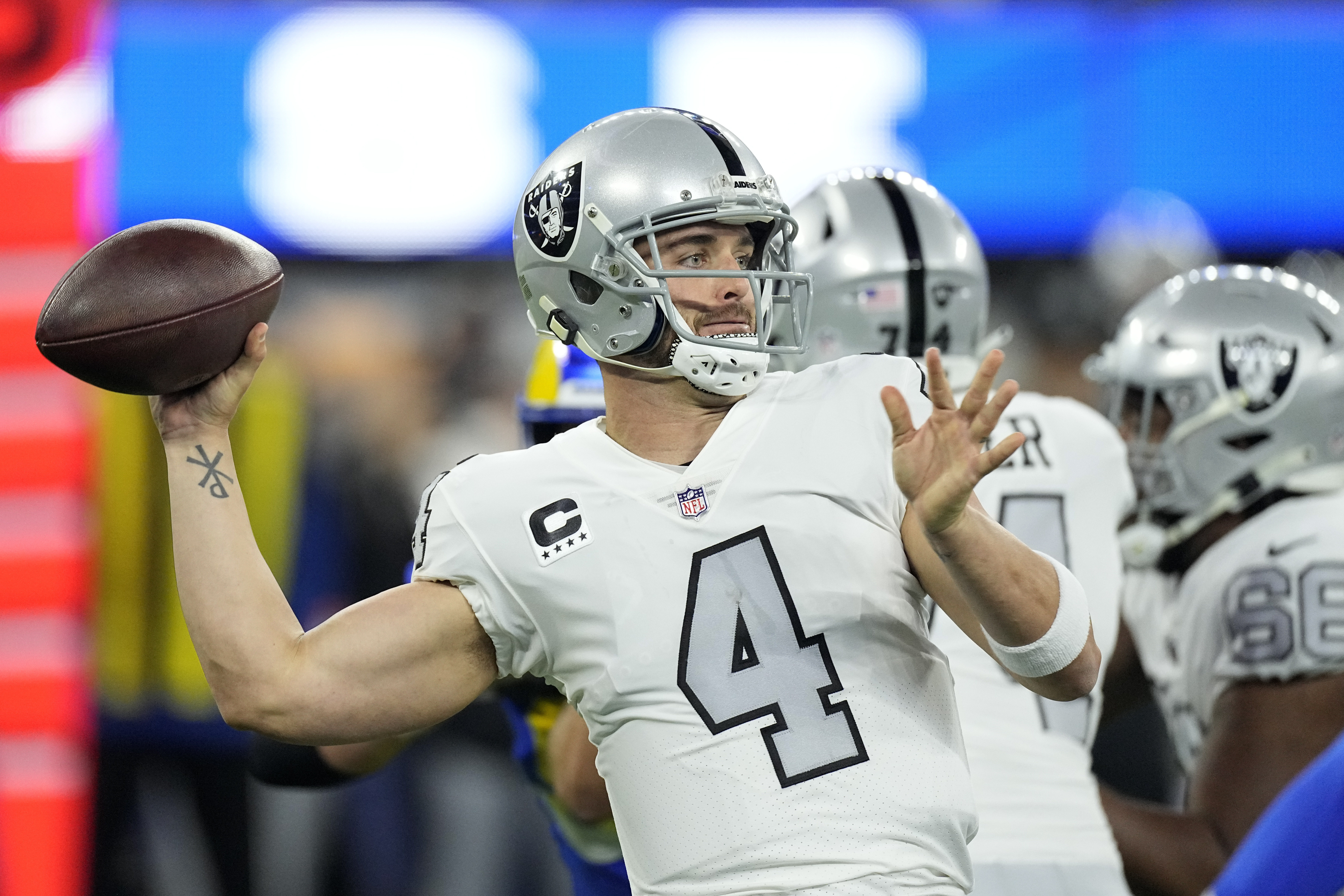 FILE - Las Vegas Raiders quarterback Derek Carr throws a pass during the first half of an NFL football game against the Los Angeles Rams, Dec. 8, 2022, in Inglewood, Calif. Carr said he will not extend the Feb. 15, 2023, deadline to help facilitate a trade from the Raiders. 
