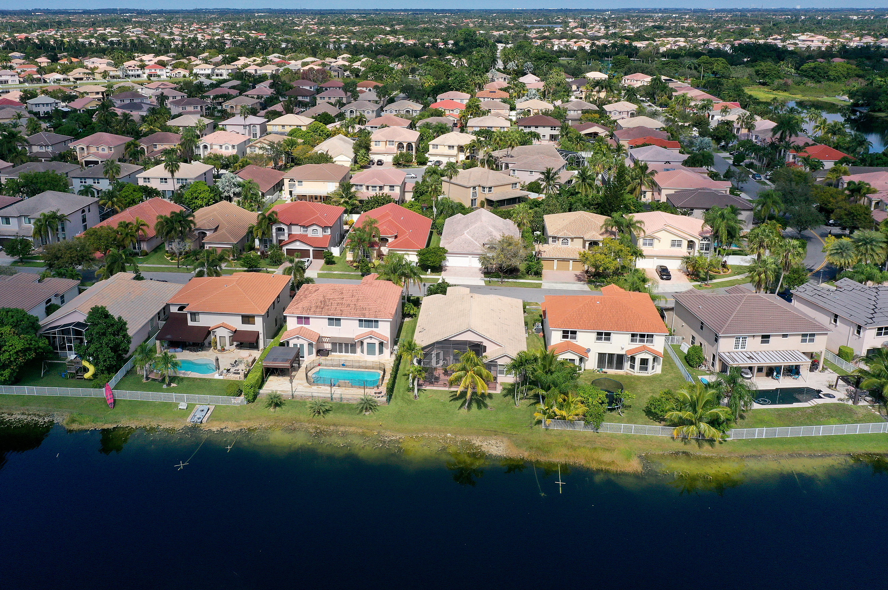 U.S. home prices fell for the sixth month in a row in December. Pictured is a residential neighborhood on Oct. 27, 2022, in Miramar, Fla.