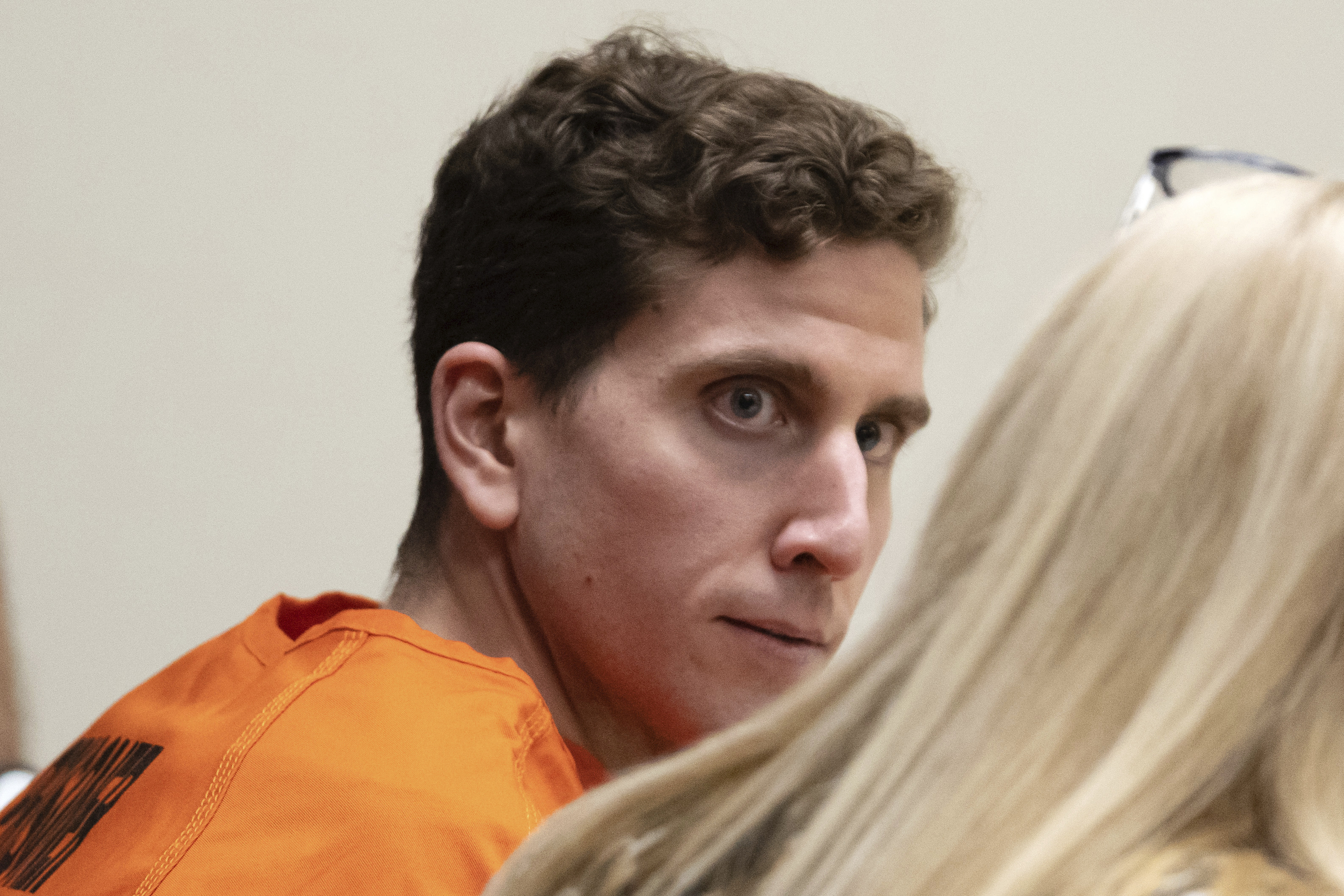 Bryan Kohberger, left, who is accused of killing four University of Idaho students, looks toward his attorney, Anne Taylor, right, Jan. 5, in Moscow, Idaho. Law enforcement officials seized dark clothing, medical gloves, and other items from a Pennsylvania home where they arrested Kohberger, according to court documents made public Tuesday.
