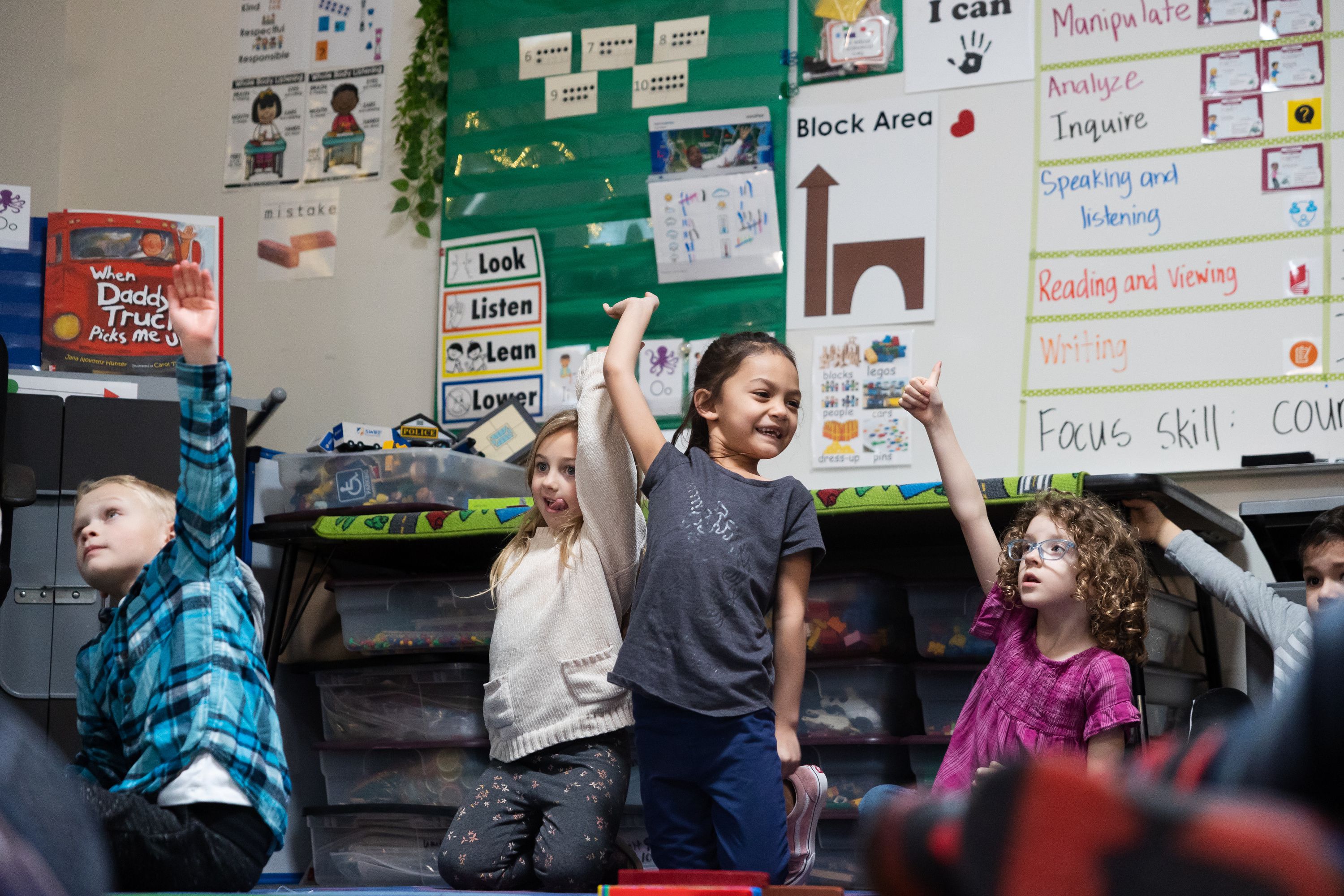 Students raise their hands during a lesson in a full-day kindergarten class at East Sandy Elementary School in Sandy on Monday. A Senate resolution that would ask Utahns whether to amend the Utah Constitution to eliminate the decades' old earmark on income tax revenue for education passed the Utah Senate Tuesday night.
