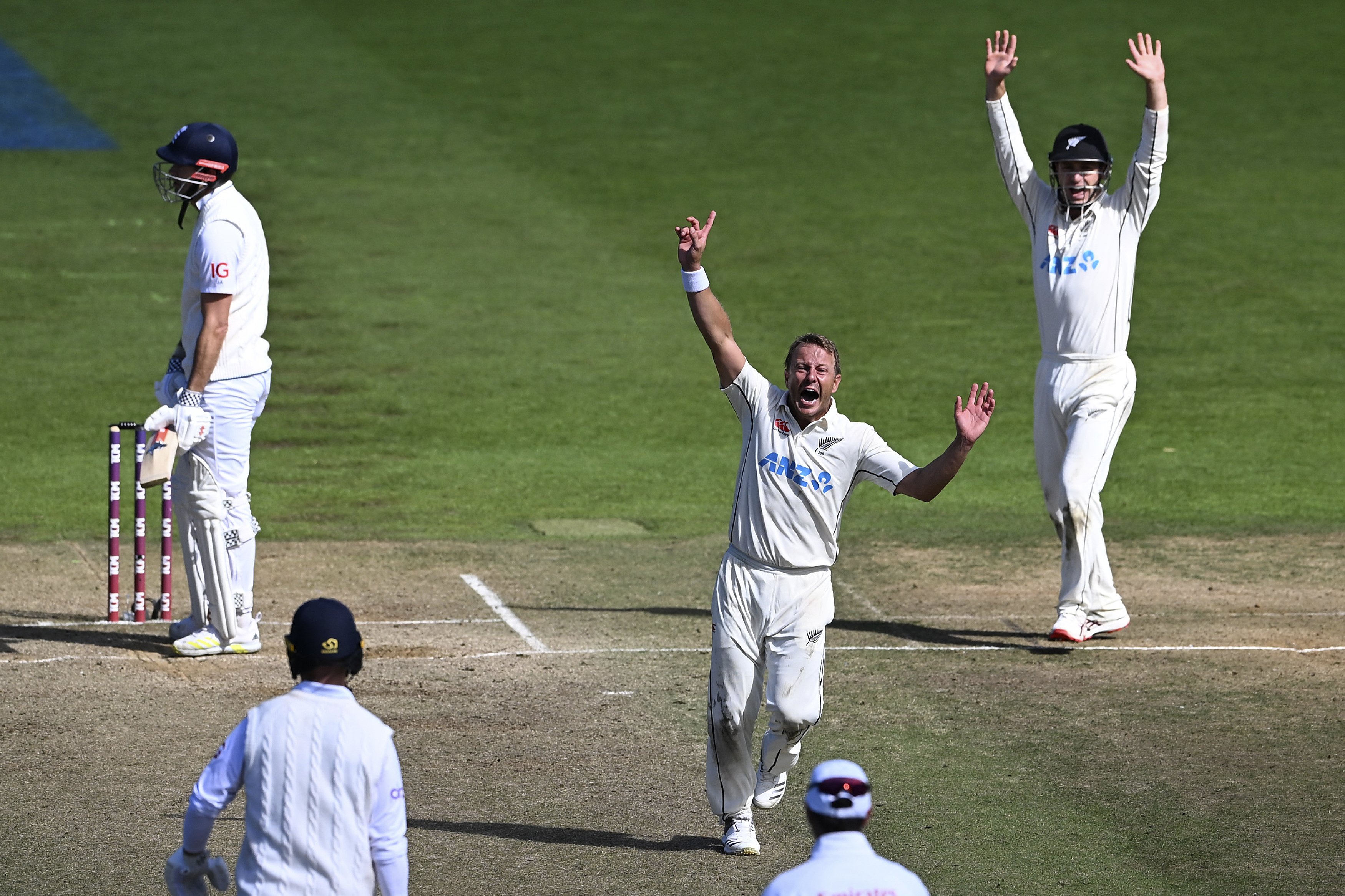 New Zealand's Neil Wagner, center, celebrates the wicket of England's James Anderson, left, for the win by 1 run on day 5 of their cricket test match in Wellington, New Zealand, Tuesday, Feb 28, 2023. 