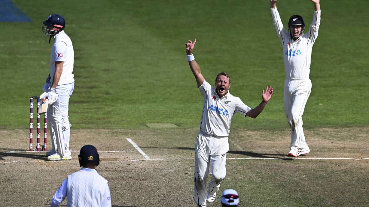 New Zealand's Neil Wagner, center, celebrates the wicket of England's James Anderson, left, for the win by 1 run on day 5 of their cricket test match in Wellington, New Zealand, Tuesday, Feb 28, 2023.