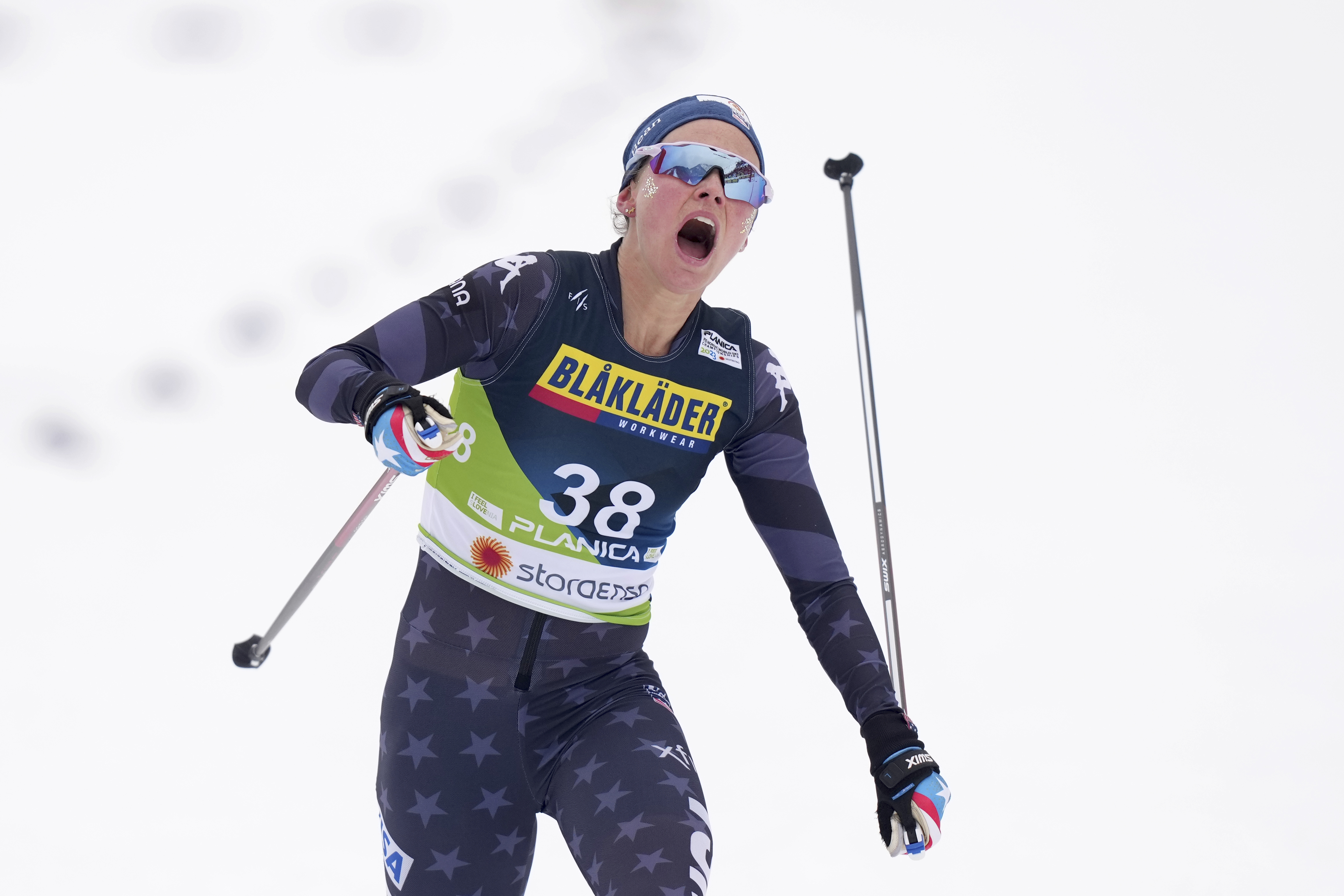 Jessie Diggins, of the United States, crosses the finish line in the Women's Cross Country Interval Start 10 KM Free event at the Nordic World Championships in Planica, Slovenia, Tuesday, Feb. 28, 2023. 