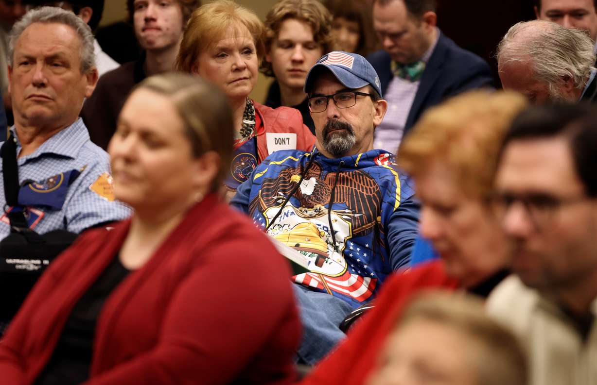 A man wears a Utah flag shirt as people discuss SB31 State Flag Amendments during a House Economic Development and Workforce Services Standing Committee meeting in Salt Lake City, on Tuesday.
