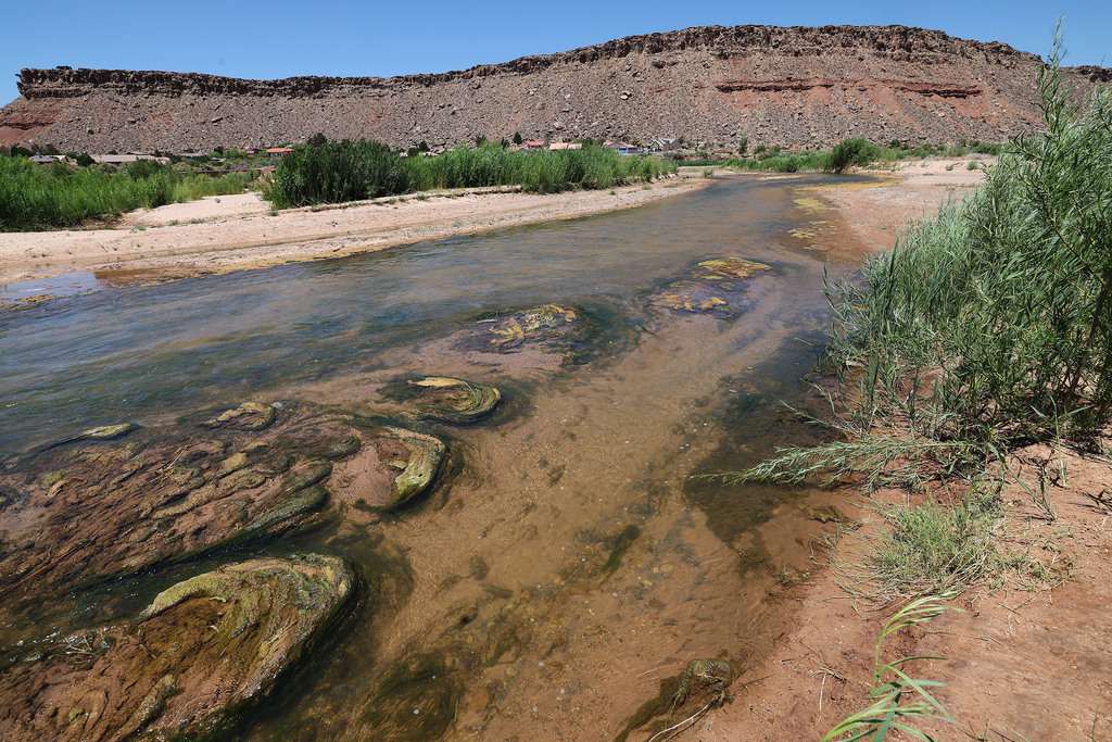The shallow Virgin River flows through St. George on June 10, 2022.