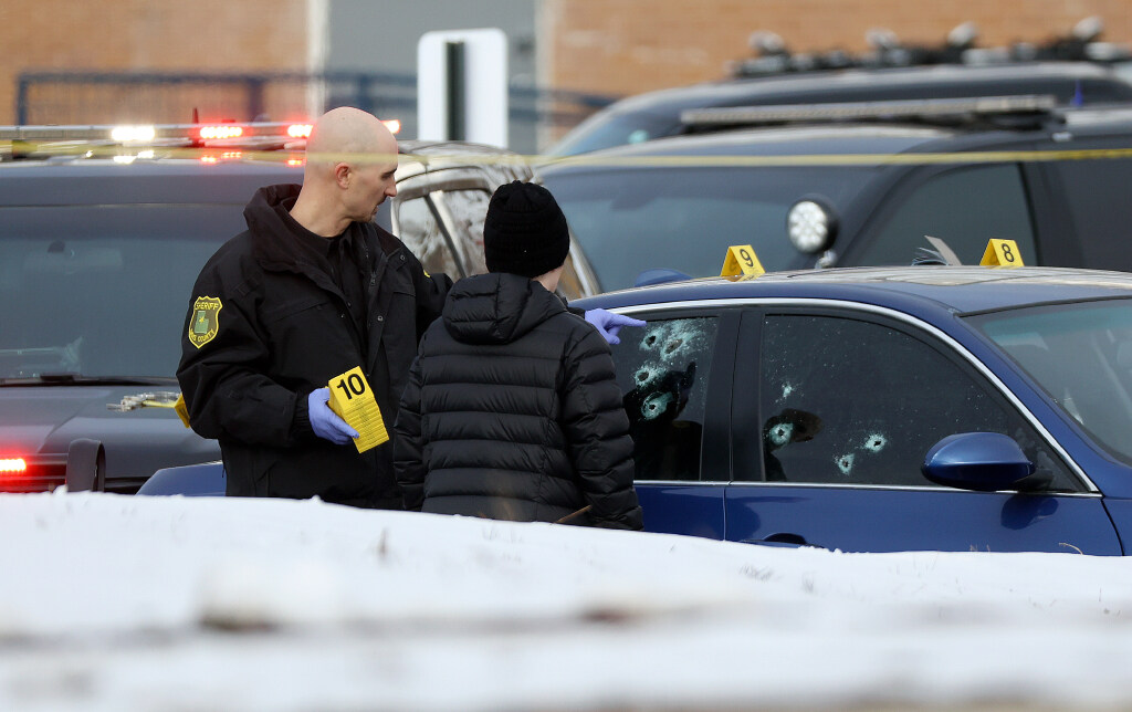 Emergency responders work at the scene of a police shooting in Farmington on Wednesday. The man shot by officers following what began as a "routine traffic stop" has died.