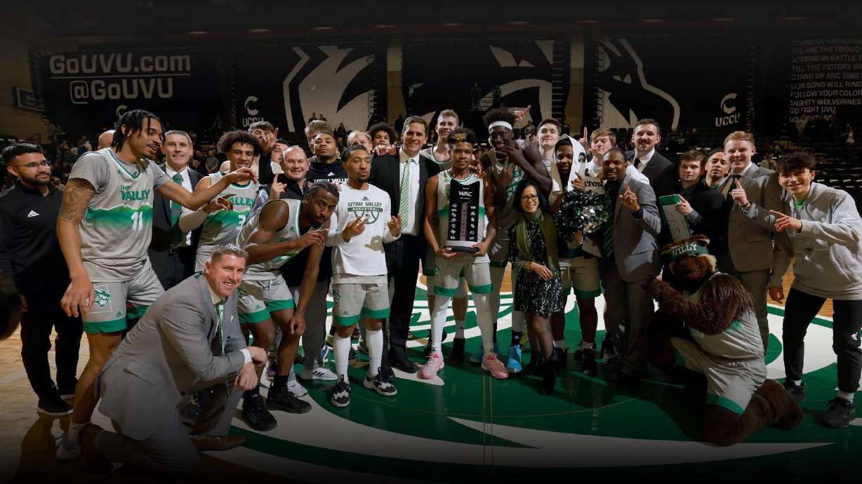 Utah Valley men's basketball poses for a photo with the WAC championship trophy after a win against UT Arlington, Wednesday, March 1, 2023 at the UCCU Center in Orem.