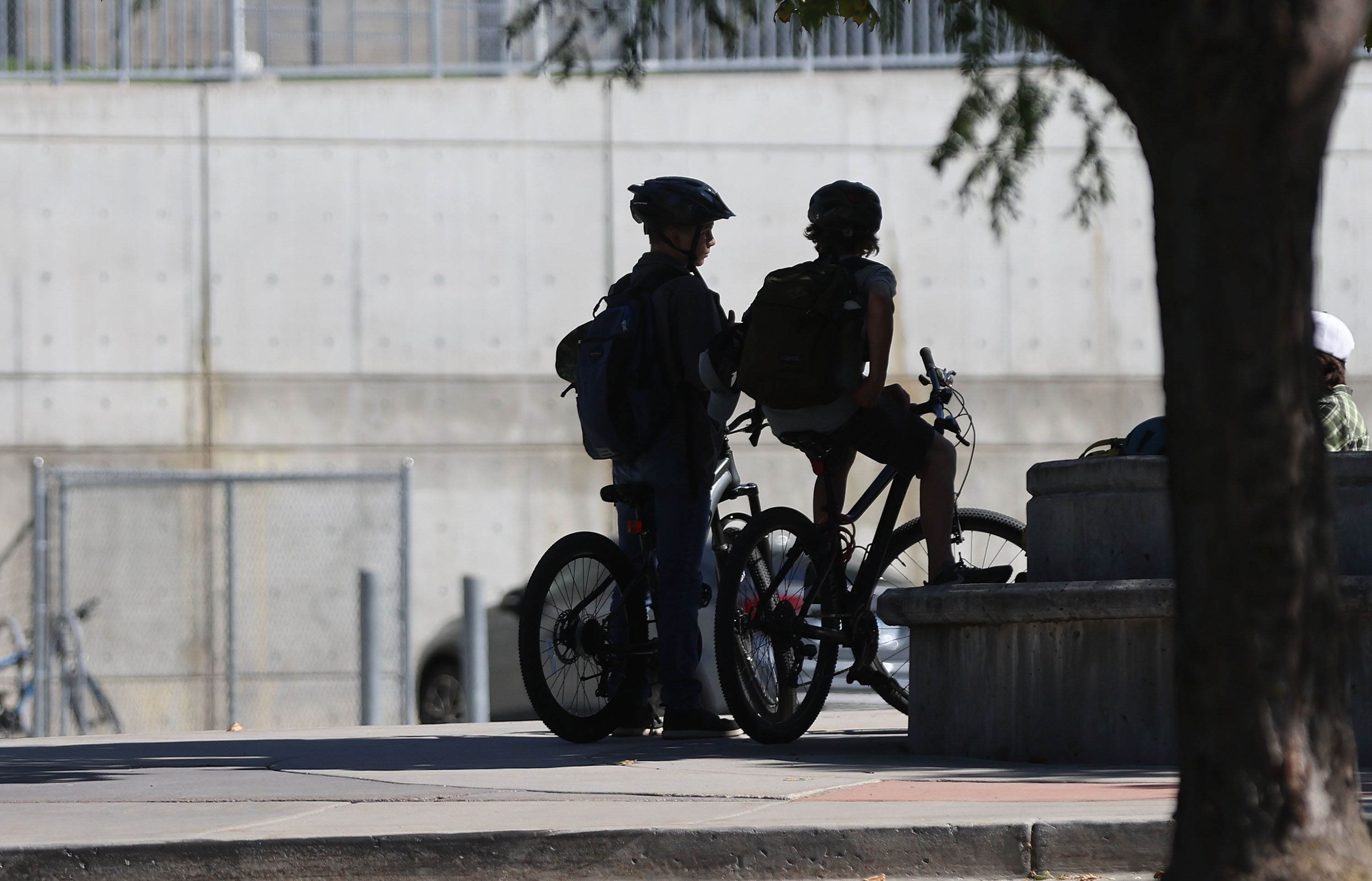 Kids prepare to ride bikes in front of William Penn Elementary in Millcreek on Sept. 22, 2022. A bill seeks to reduce the significant spike in chronic absenteeism in Utah schools. 
