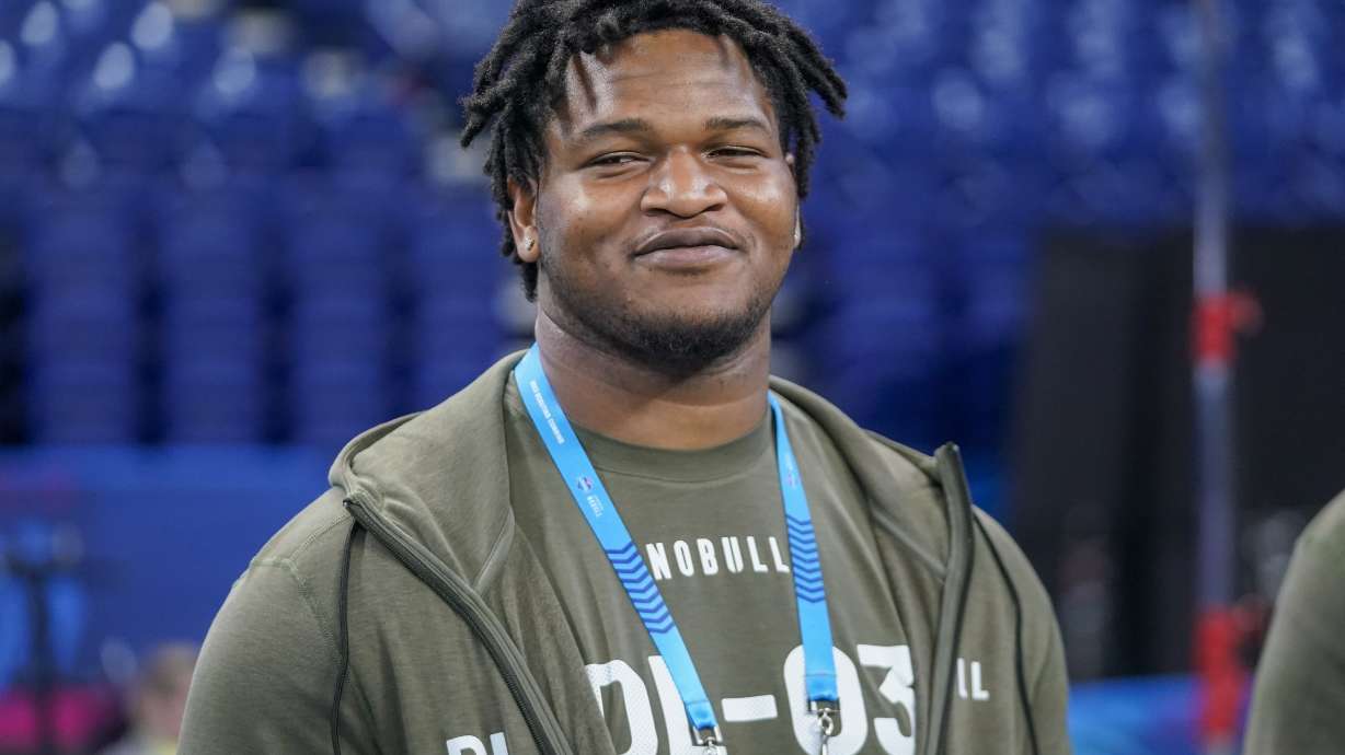 Georgia defensive lineman Jalen Carter watches as players warm up on the field before the NFL football scouting combine in Indianapolis, Thursday, March 2, 2023.