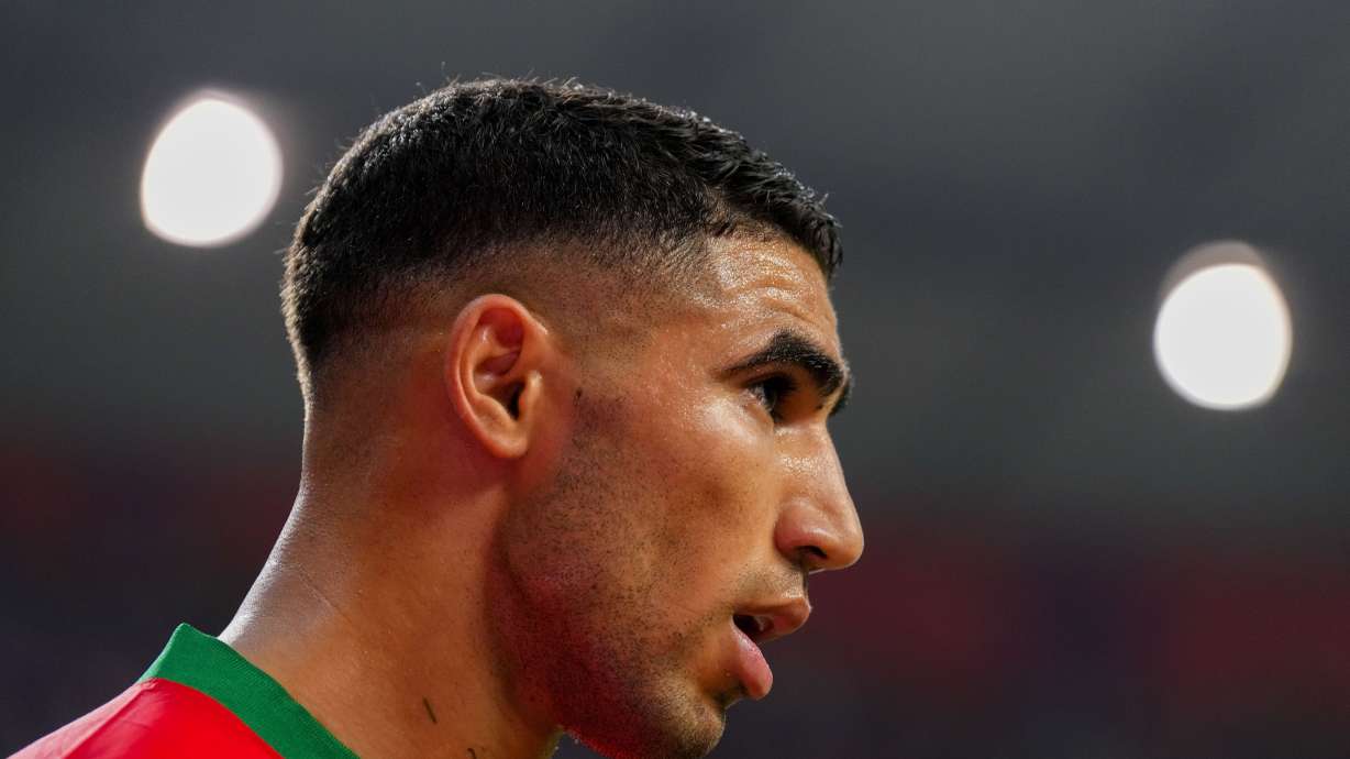 FILE - Morocco's Achraf Hakimi reacts during the World Cup third-place playoff soccer match between Croatia and Morocco at Khalifa International Stadium in Doha, Qatar, Saturday, Dec. 17, 2022. French prosecutors said Friday that Paris Saint-Germain defender and Morocco international star Achraf Hakimi has been indicted on rape charges.