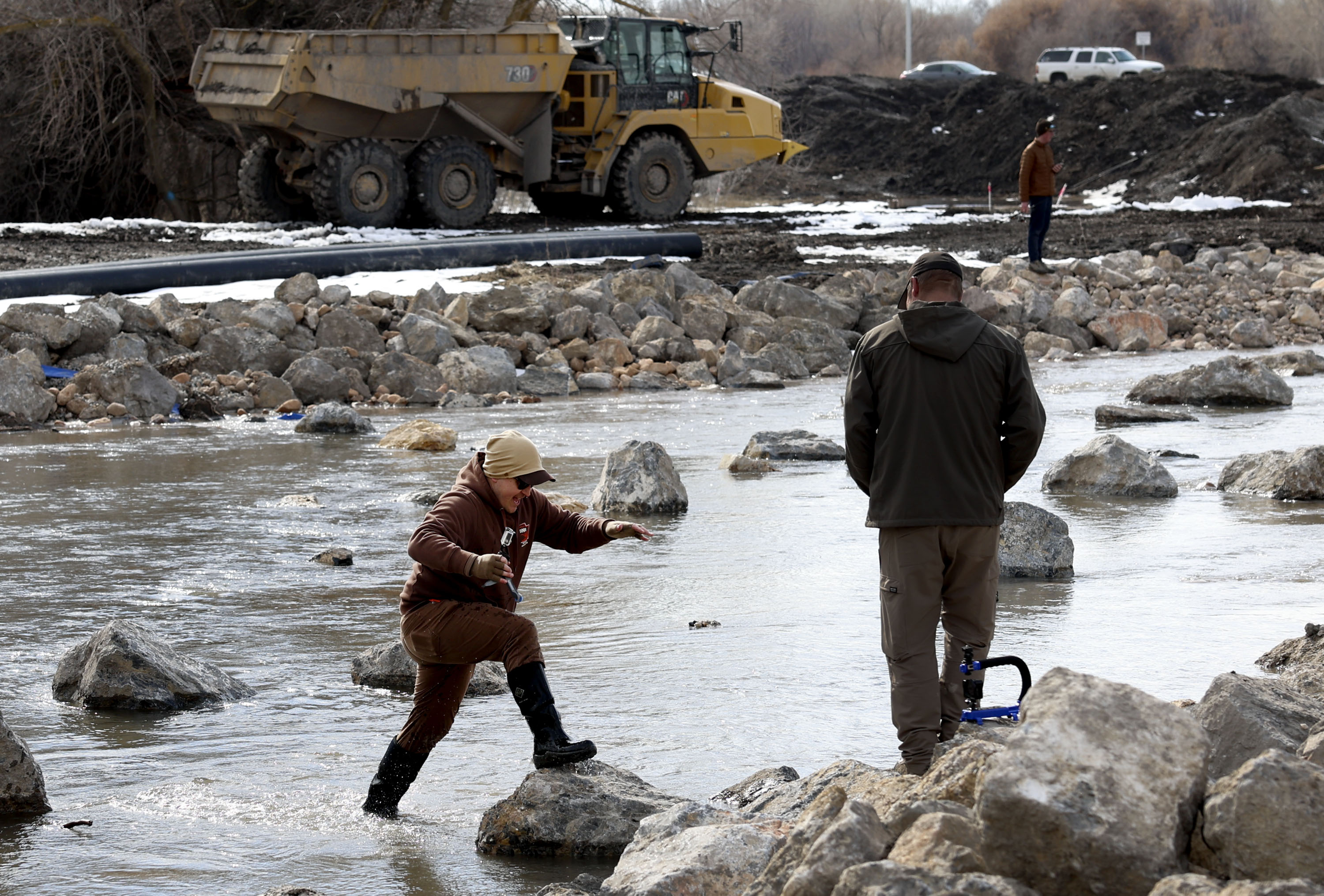 A man crosses the river at the Provo River Delta Restoration Project in Provo Thursday. The project is considered a "major milestone" by wildlife officials in the efforts to preserve the threatened June sucker endemic in the Provo River and Utah Lake.