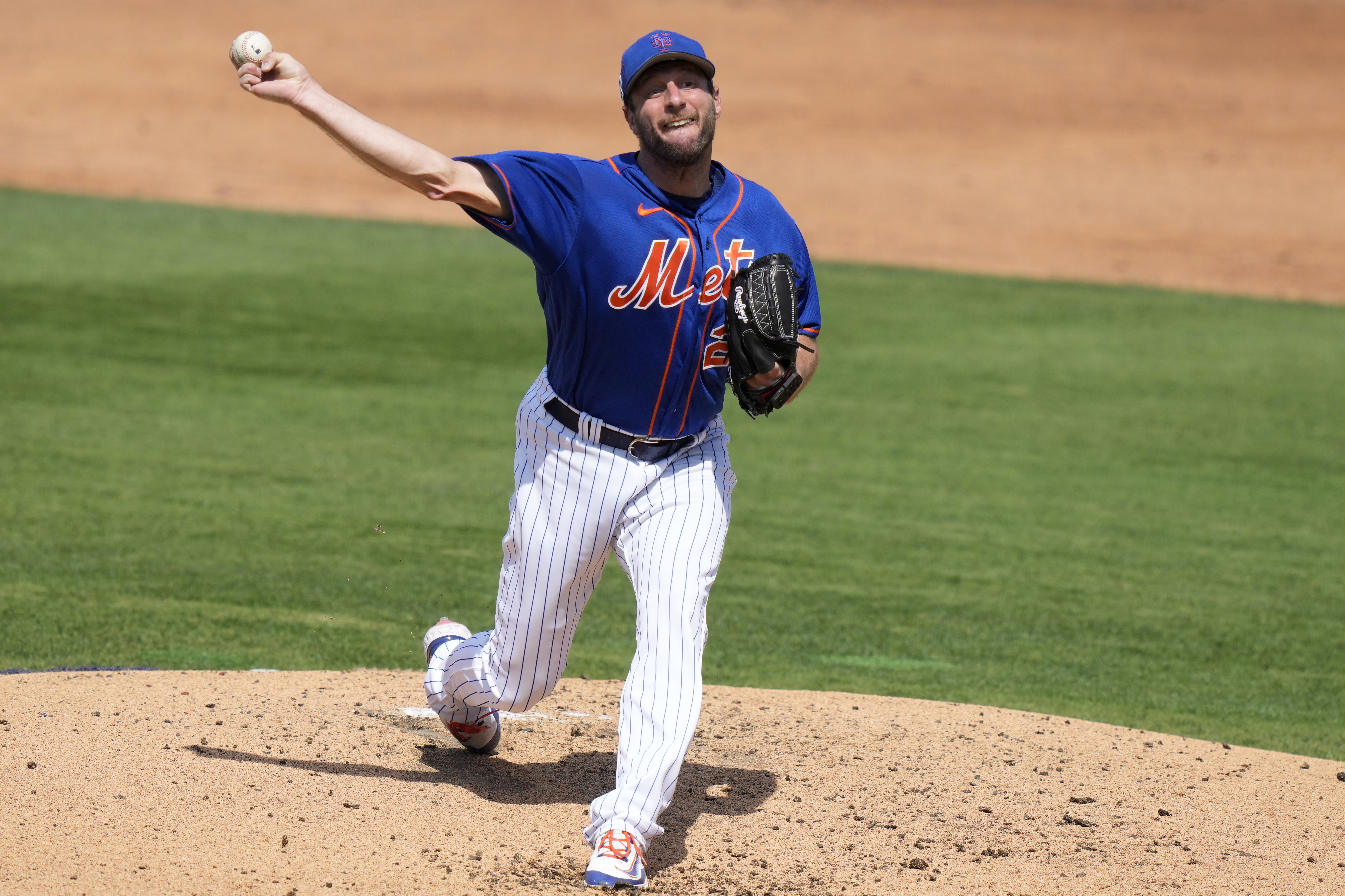 New York Mets starting pitcher Max Scherzer throws during the third inning of a spring training baseball game against the Washington Nationals, Friday, March 3, 2023, in Port St. Lucie, Fla. 