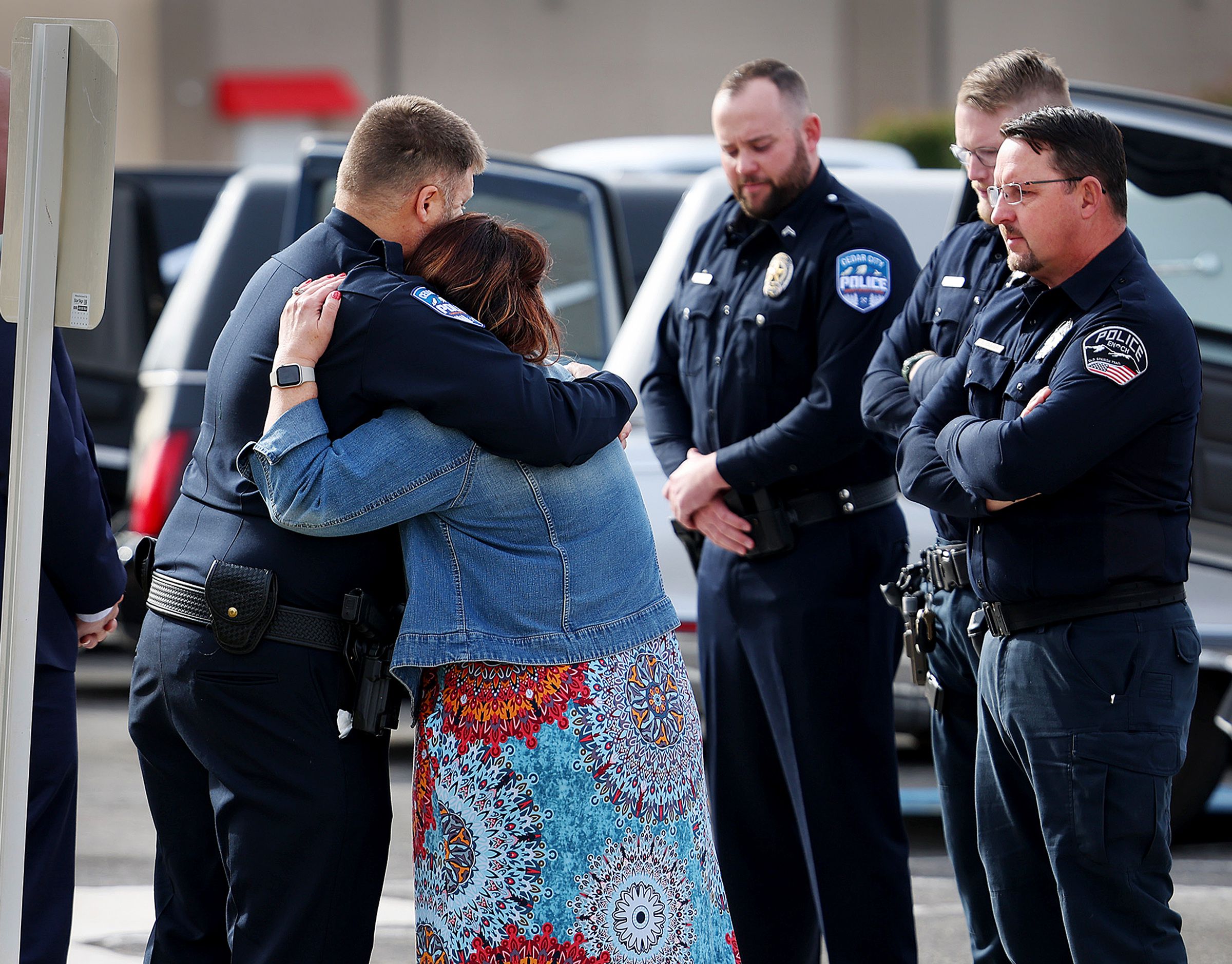 A woman hugs each law enforcement member as they wait to bring the caskets out after funeral services were held in La Verkin, Washington County, for members of the Haight and Earl families. Tausha Haight, her 17-year-old daughter Macie, 12-year-old daughter Brilee, 7-year-old twins Sienna and Ammon, 4-year-old son Gavin and Height’s mother Gail Earl were laid to rest in the La Verkin City Cemetery on Jan. 13.