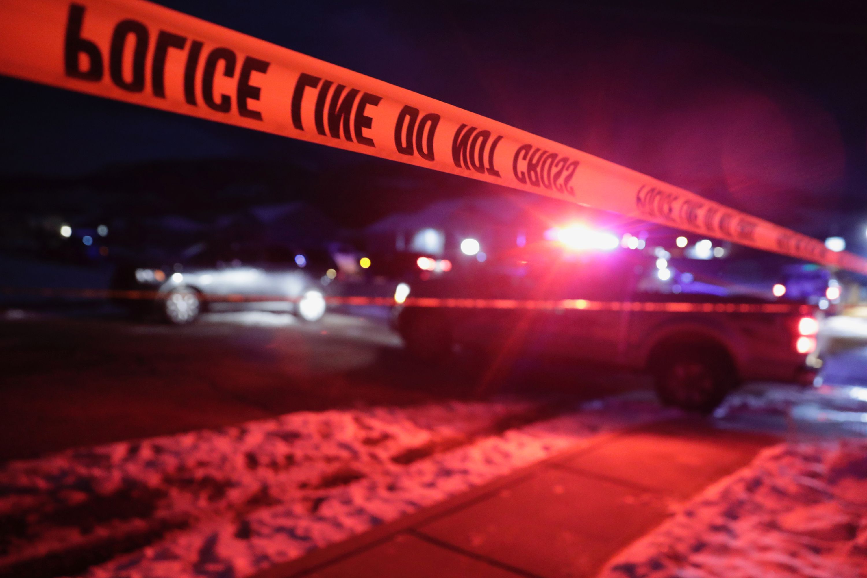 Police tape surrounds the crime scene in Enoch, Iron County, where eight members of a family were found shot to death on Jan. 4.