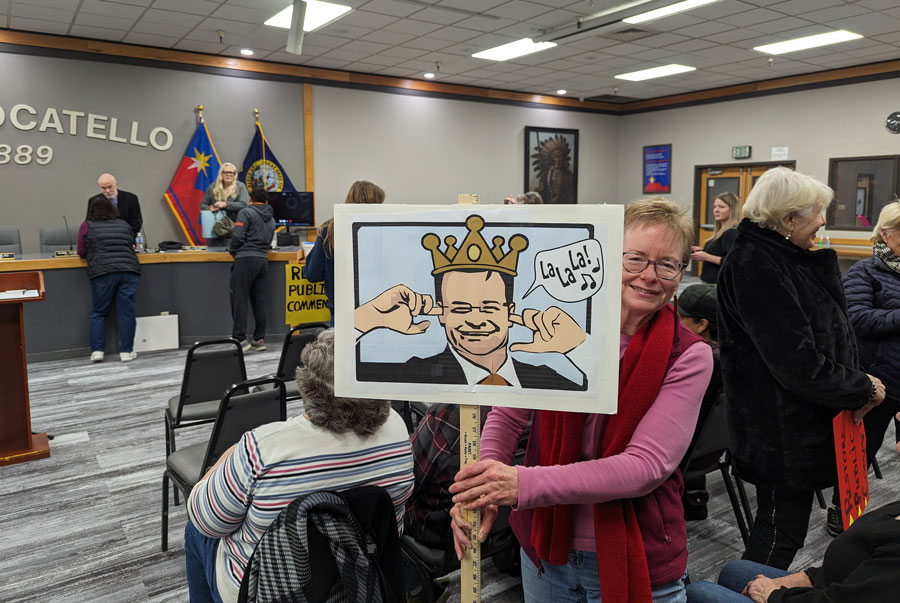 One of the signs held up throughout Thursday’s Pocatello City Council meeting shows Mayor Brian Blad wearing a crown and covering his ears. Pocatello citizens attended the meeting to show frustration with Blad's decision to eliminate the public comment portion from all future meetings.