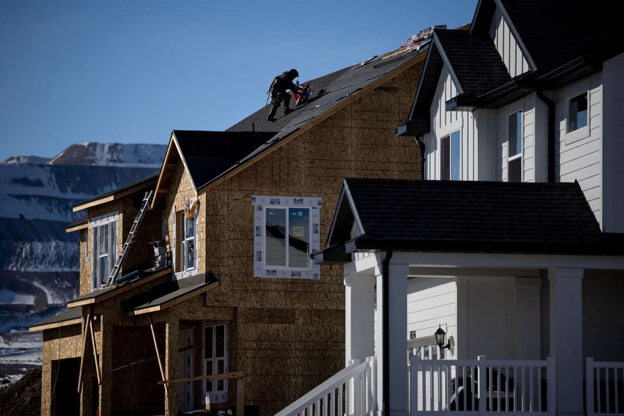 Construction continues on new homes is pictured in Herriman on Tuesday.