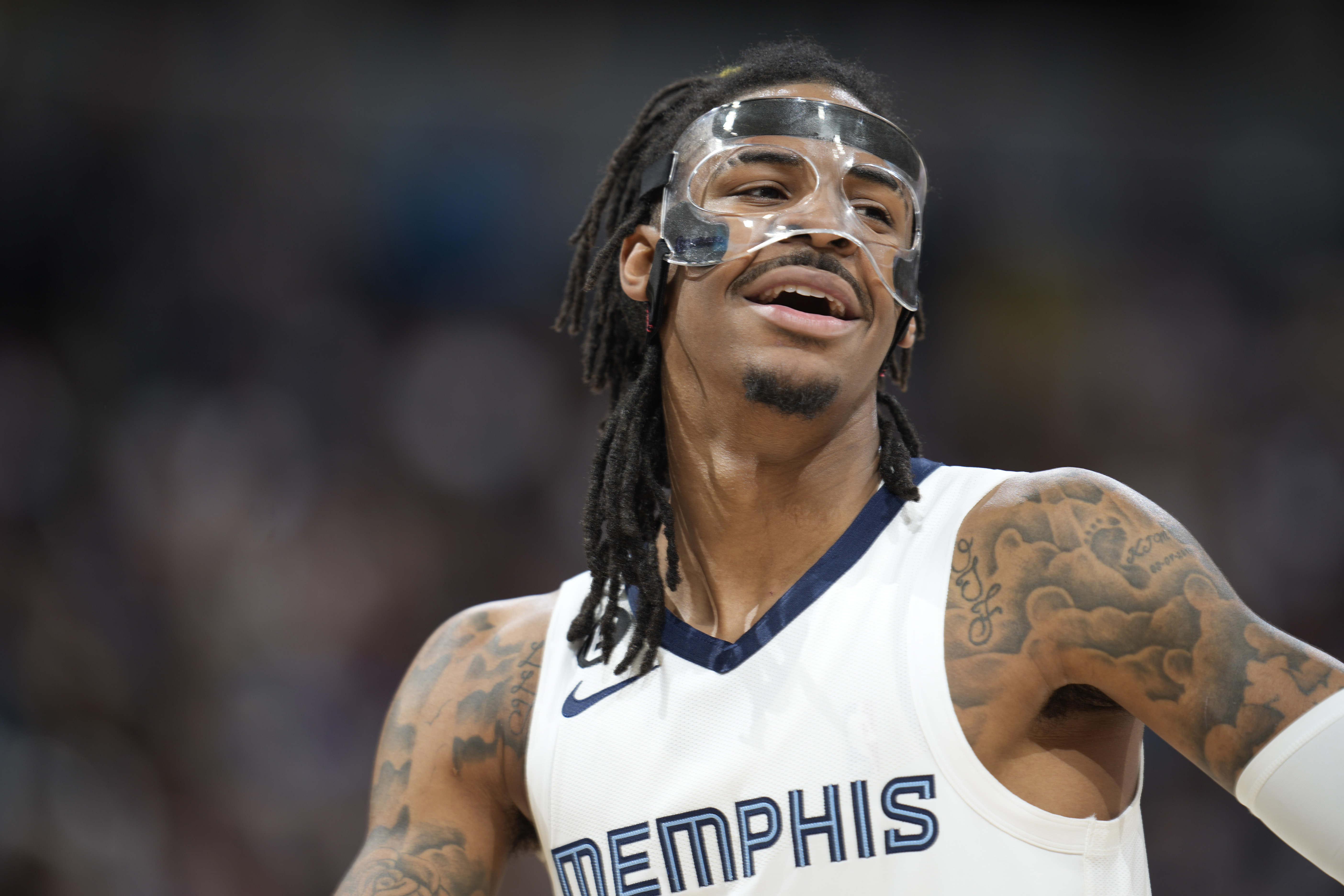 Memphis Grizzlies guard Ja Morant looks to the bench during the second half of the team's NBA basketball game against the Denver Nuggets on Friday, March 3, 2023, in Denver. 