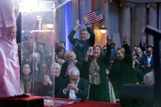 Supporters cheer as self-help author Marianne Williamson speaks to the crowd while launching her 2024 presidential campaign in Washington, Saturday. The 70-year-old onetime spiritual adviser to Oprah Winfrey became the first Democrat to formally challenge President Joe Biden for the 2024 nomination.