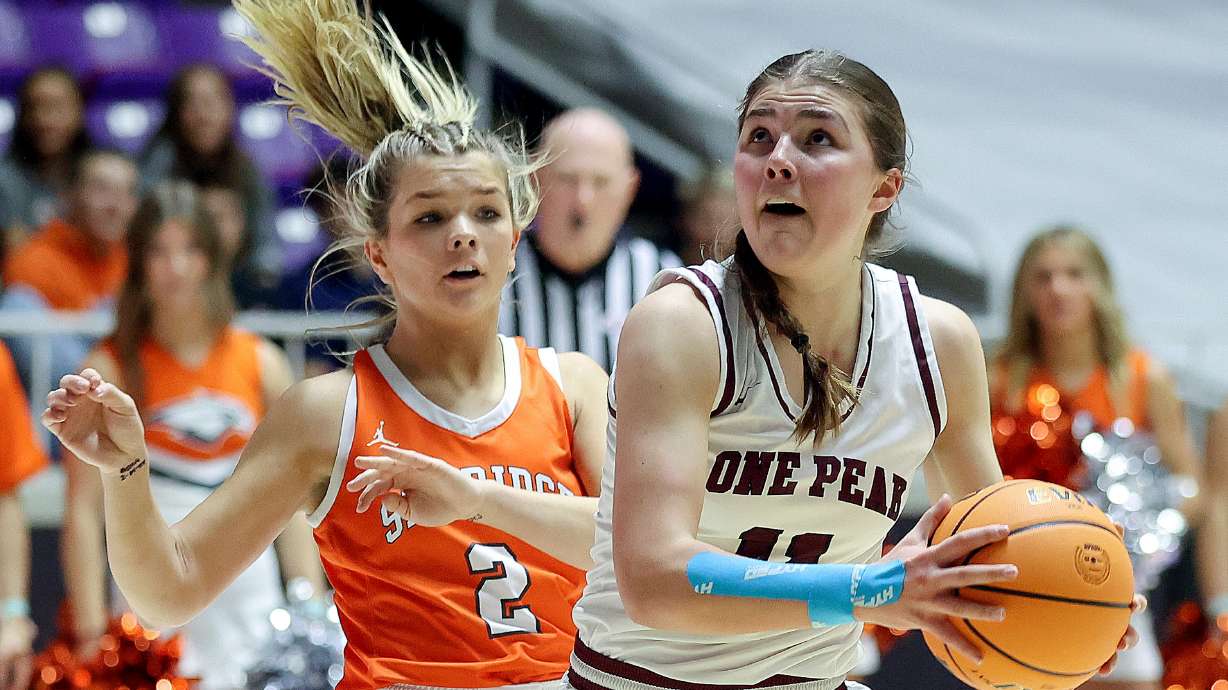Kailey Woolston, right, looks to shoot against Skyride's Shae Toole in the 6A girls basketball championship game at the Dee Events Center in Ogden, on Saturday, March 4, 2023. Lone Peak won 64-49.