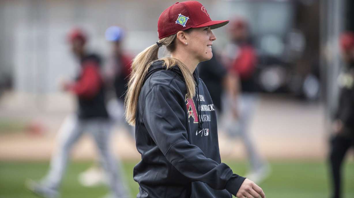 FILE - In a photo provided by the Arizona Diamondbacks, Ronnie Gajownik watches the baseball team's minor league minicamp at Salt River Fields in February 2022 in Scottsdale, Ariz. As Gajownik prepares for her first managing job in the minor leagues, took on a temporary role Saturday, March 4 — bench coach for the Arizona Diamondbacks. D-backs manager Torey Lovullo confirmed Gajownik’s spot before the spring training game against San Diego.