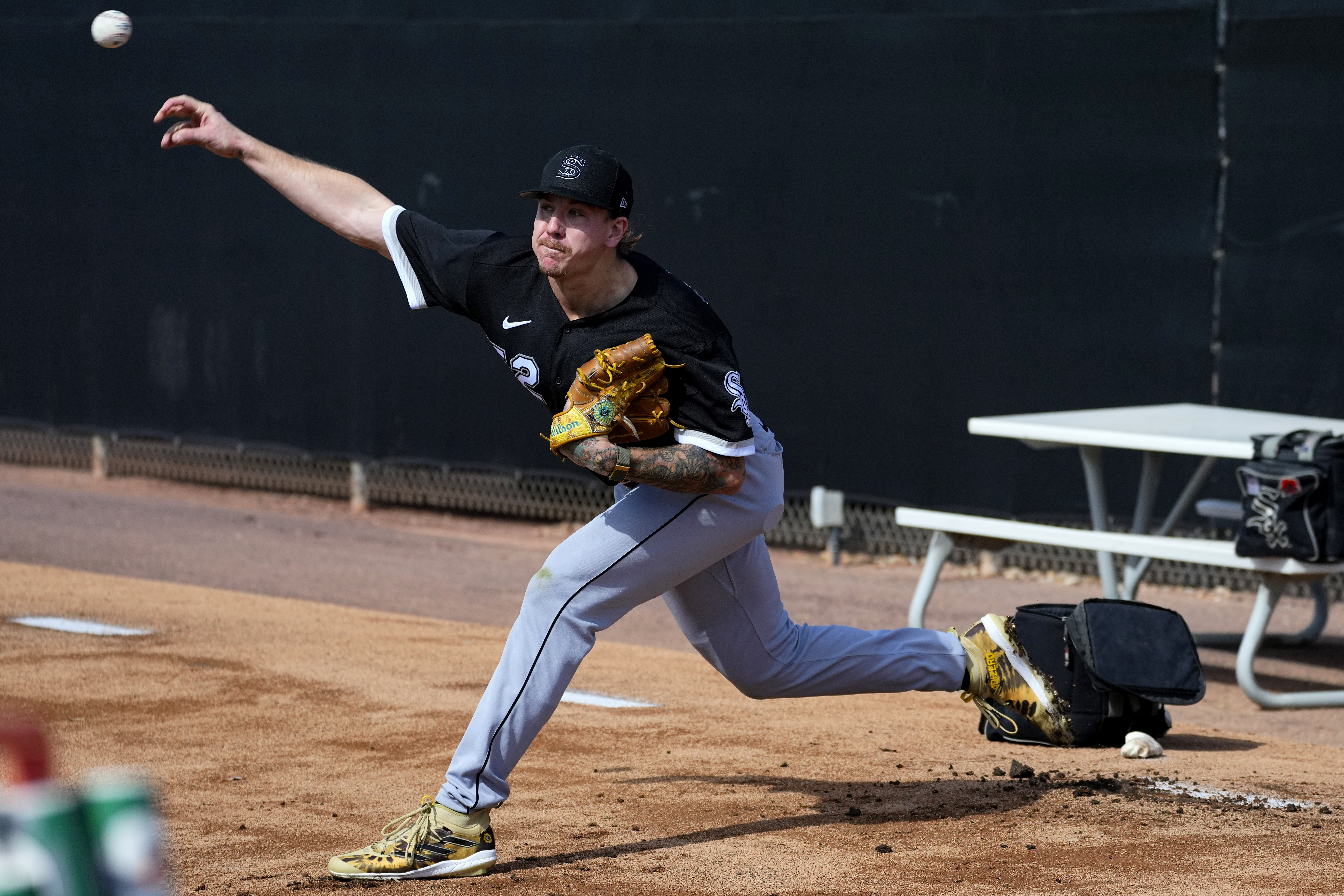 Chicago White Sox pitcher Mike Clevinger throws during an MLB spring training baseball practice, Saturday, Feb. 18, 2023, in Phoenix. 