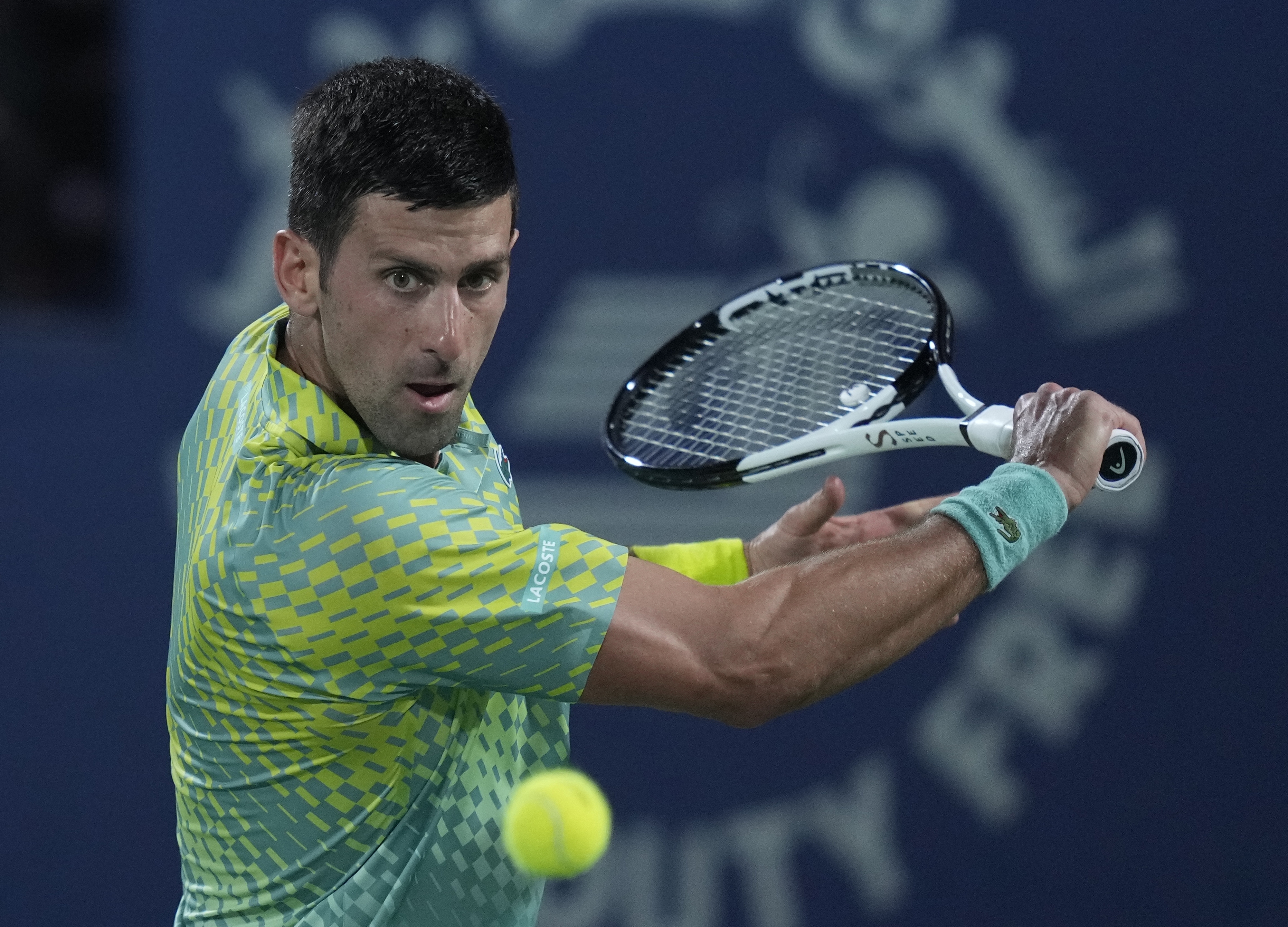 Serbia's Novak Djokovic returns the ball to Daniil Medvedev during their semi final match of the Dubai Duty Free Tennis Championships in Dubai, United Arab Emirates, Friday, March 2, 2023.