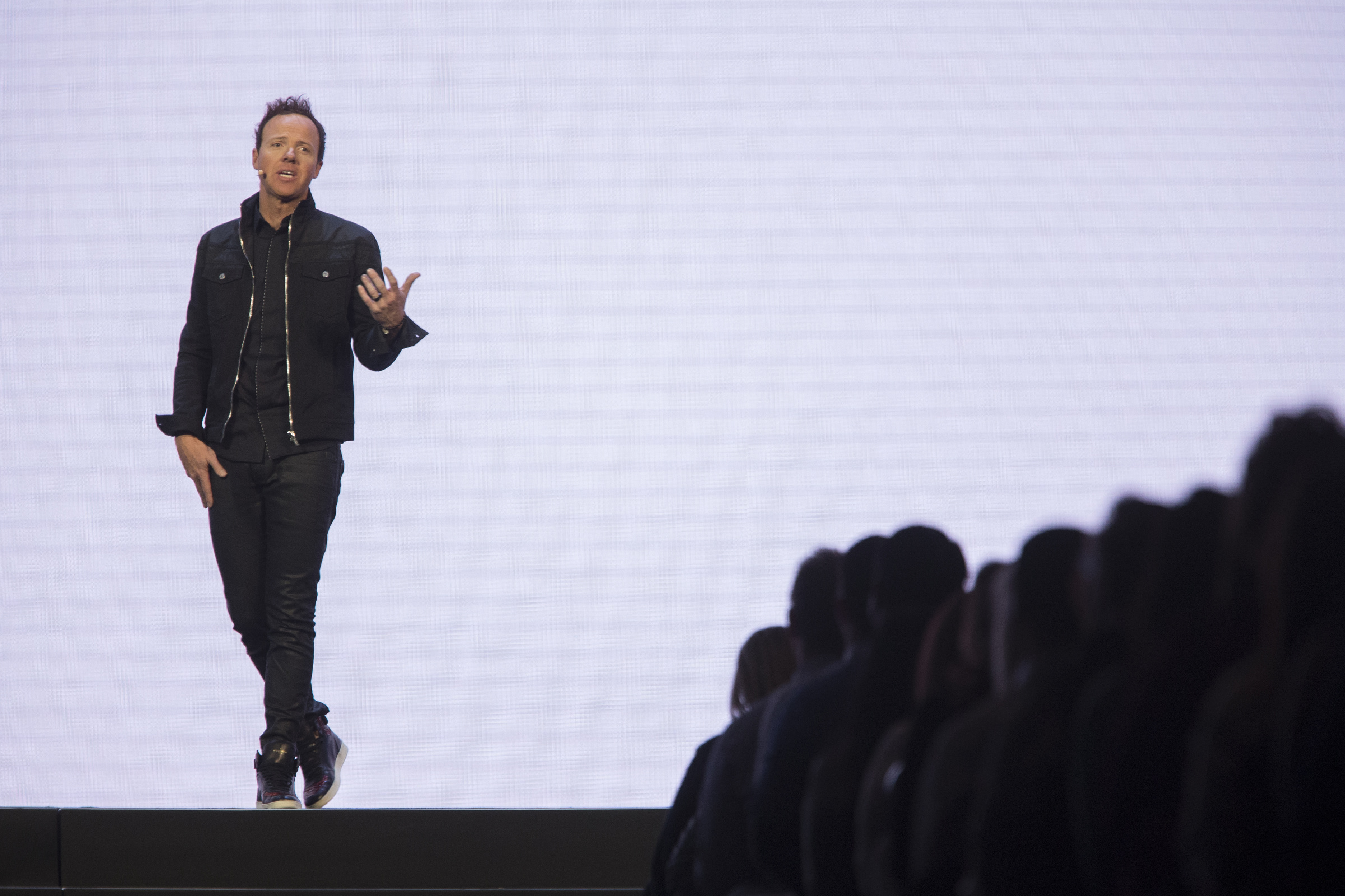 Ryan Smith, co-founder of Qualtrics, speaks during Qualtrics' X4 Summit in Salt Lake City on March 7, 2018. A $12.4 billion offer would convert Qualtrics, a Provo-born company, from a public company to private ownership.