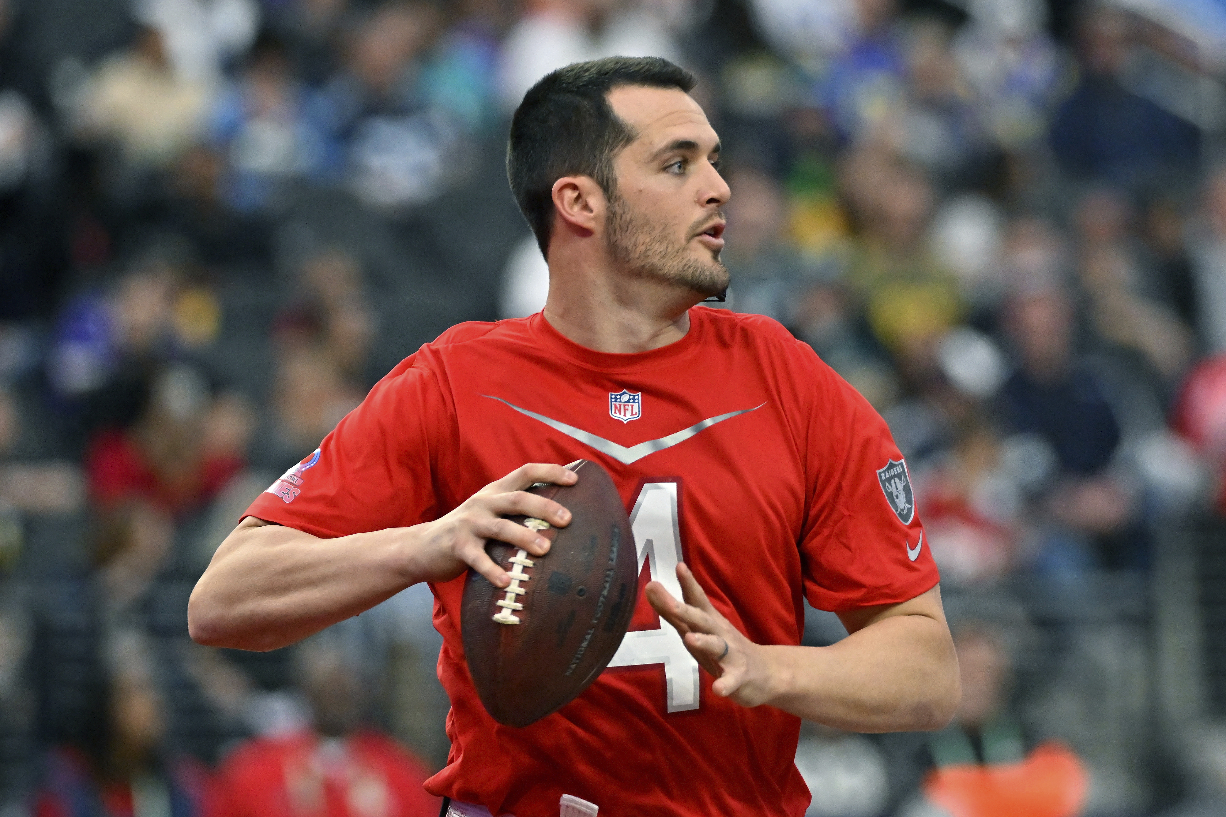 FILE - AFC quarterback Derek Carr (4) of the Las Vegas Raiders looks to pass during the flag football event at the NFL Pro Bowl, Sunday, Feb. 5, 2023, in Las Vegas. Former Raiders quarterback Derek Carr has agreed to a four-year contract with the New Orleans Saints, a personal familiar with the agreement said Monday, March 6, 2023.