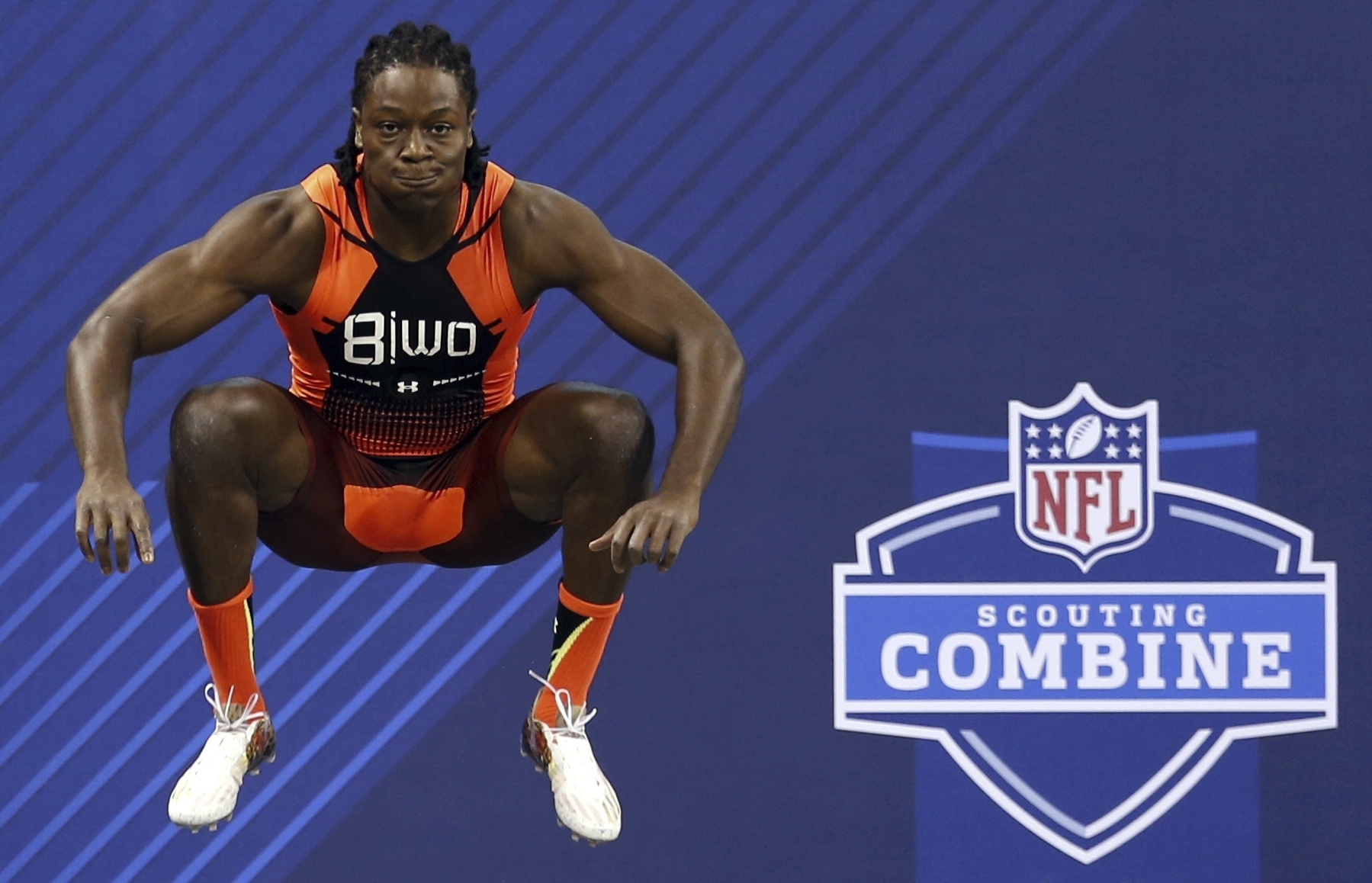 FILE - Georgia wide receiver Chris Conley prepares to run the 40-yard dash at the NFL football scouting combine, Feb. 21, 2015, in Indianapolis. Conley jumped 45.0 inches in the vertical jump at the combine. 