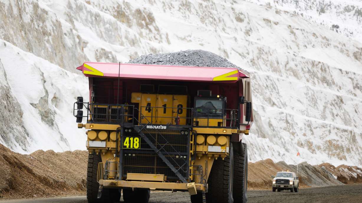 A haul truck looms over a crew truck with a full load of copper ore waste at the Rio Tinto Kennecott Copper Mine in Herriman on Feb. 20. The United States is more than 50% dependent on foreign imports for 51 important mineral commodities.