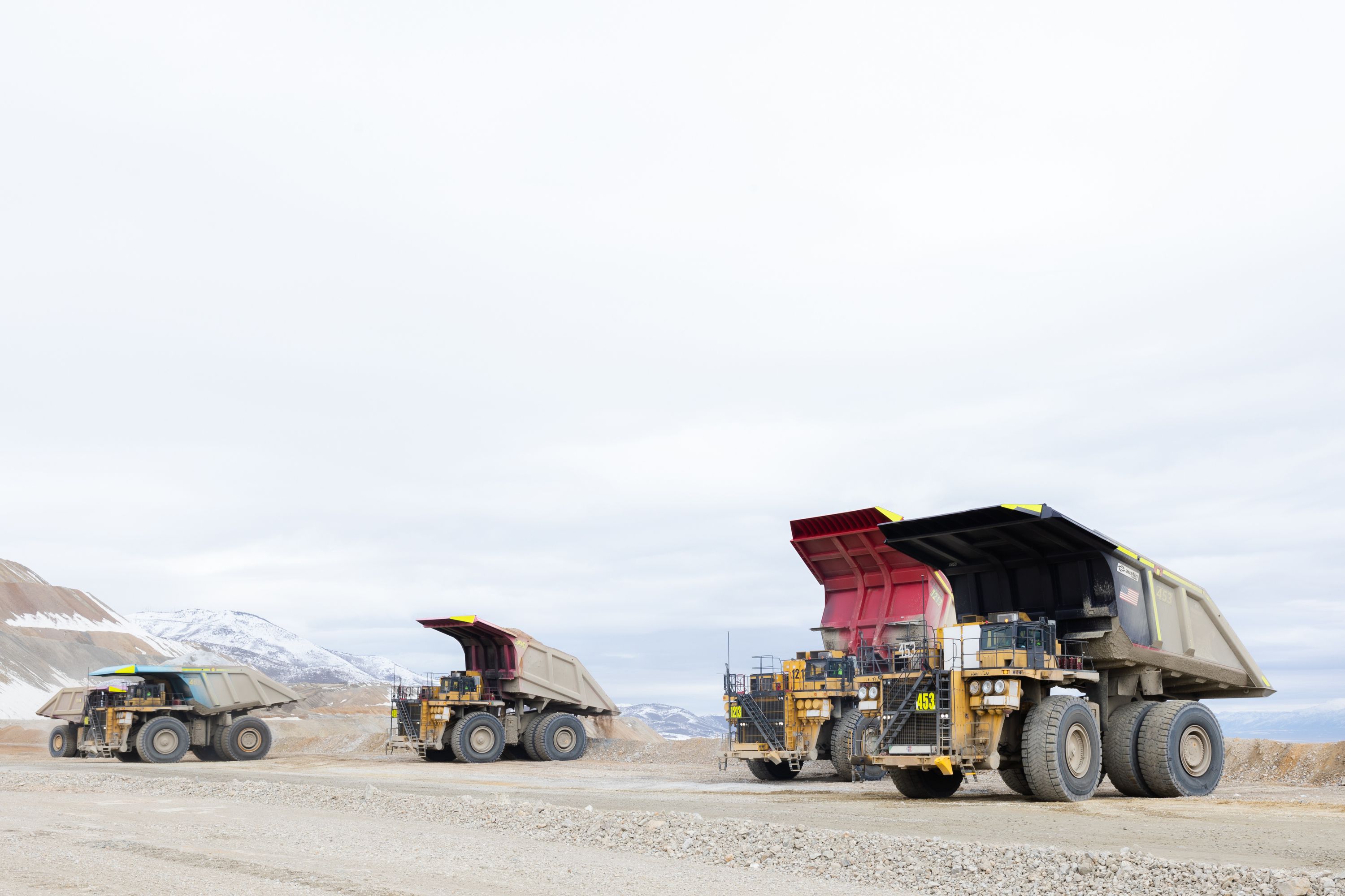 Haul trucks filled with copper ore waste prepare to dump at the Rio Tinto Kennecott Copper Mine in Herriman on Feb. 20.