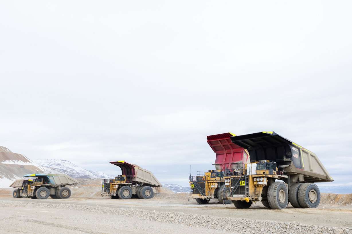 Haul trucks filled with copper ore waste prepare to dump at the Rio Tinto Kennecott Copper Mine in Herriman on Feb. 20.