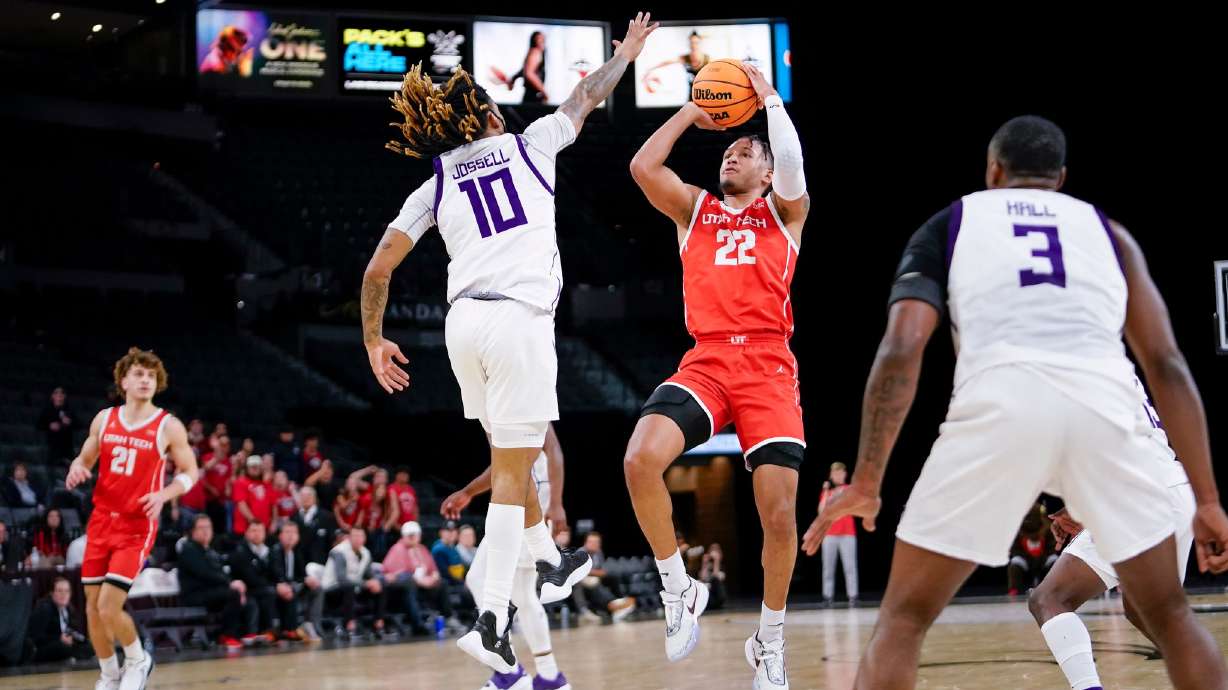 Utah Tech's Frank Staine shoots over Stephen F. Austin's Latrell Jossell during the Trailblazers' 80-76 overtime win in the Western Athletic Conference Tournament, Tuesday, March 7, 2023 at Michelob ULTRA Arena in Las Vegas.