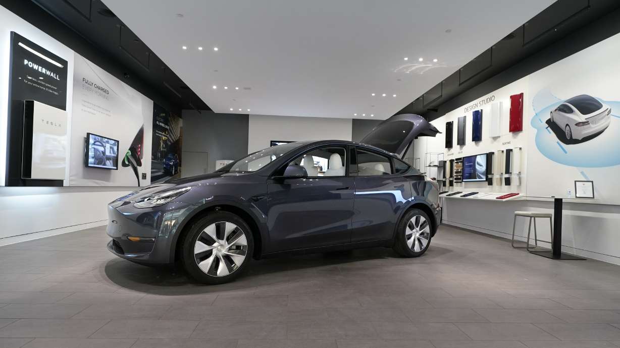A Tesla Model Y Long Range is displayed on Feb. 24, 2021, at the Tesla Gallery in Troy, Mich. U.S. auto safety regulators have opened an investigation into Tesla’s Model Y SUV after getting two complaints that the steering wheels can come off while being driven.
