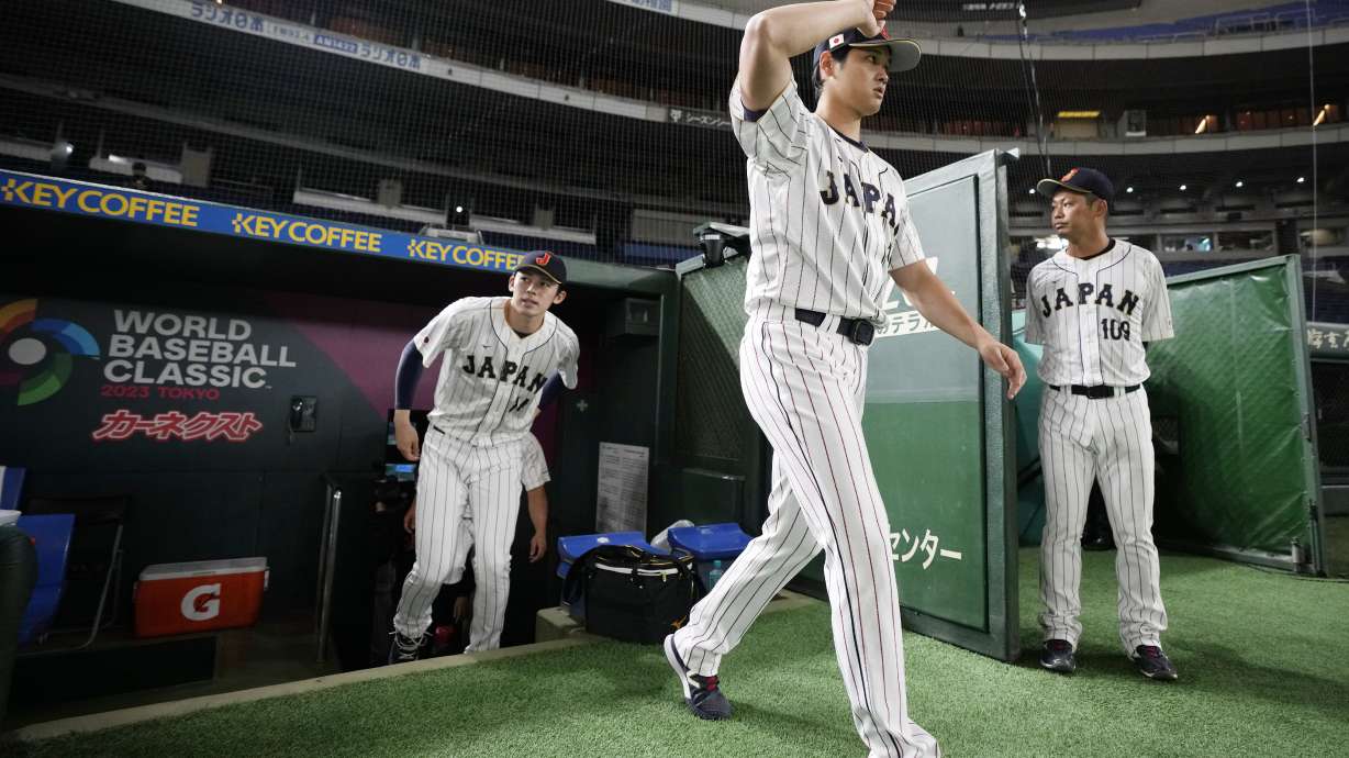 Japan's Shohei Ohtani, walks to participate a group photo session before an official training session prior to the Pool B game at the World Baseball Classic (WBC) at the Tokyo Dome Wednesday, March 8, 2023, in Tokyo.