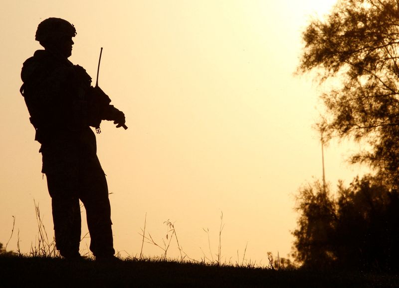 A U.S. soldier stands guard during a peace conference in al-Zawra amusement park in Baghdad Nov. 7, 2008. A U.S. Senate committee backed legislation on Wednesday to repeal two authorizations for past wars in Iraq.