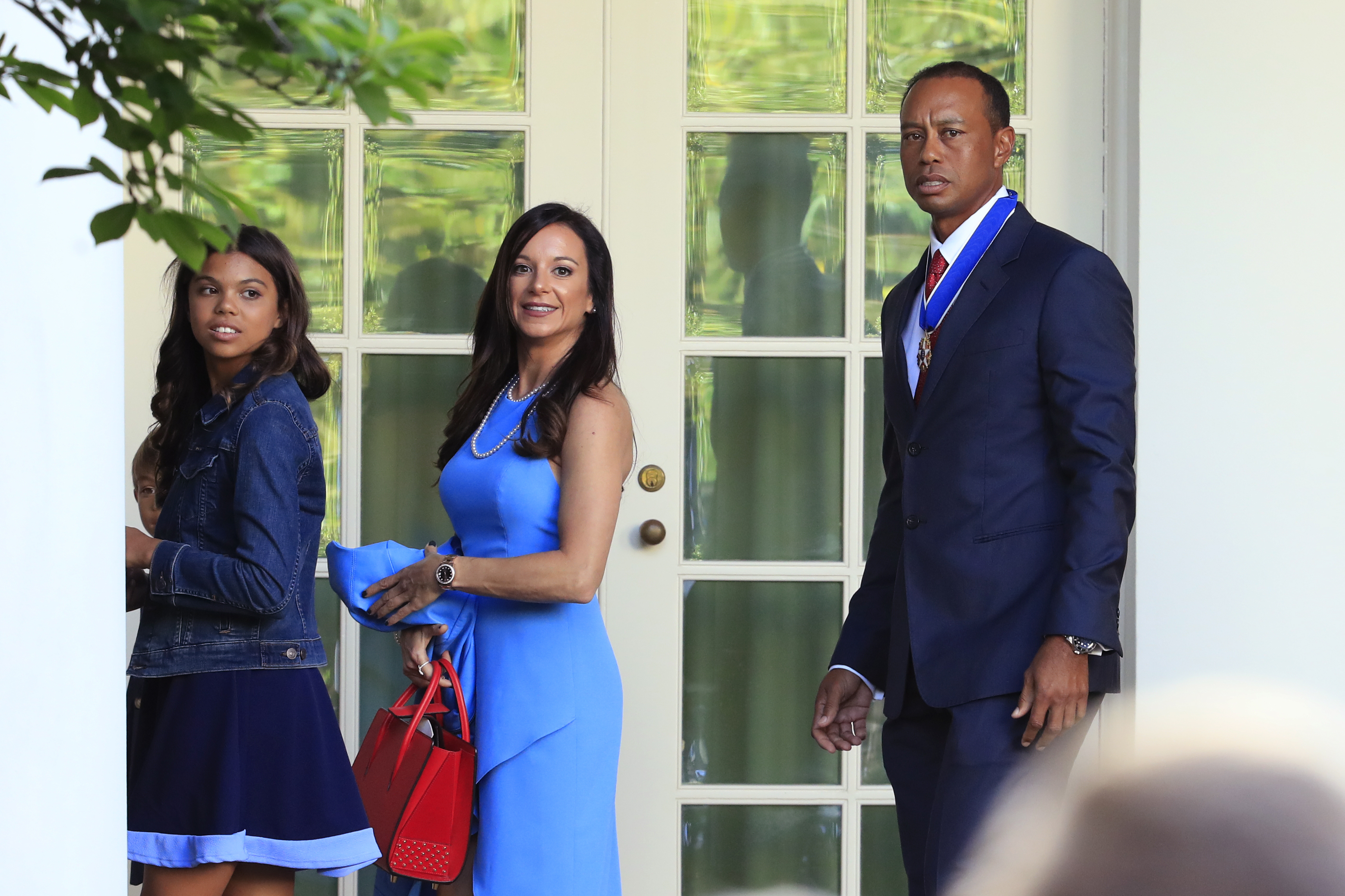 FILE - Tiger Woods, right, with his daughter Sam Alexis Woods, left, and his girlfriend Erica Herman, center, walk along the Colonnade following a ceremony where President Donald Trump awarded the Presidential Medal of Freedom to Tiger Woods at the White House in Washington, on May 6, 2019. Herman wants to nullify a nondisclosure agreement following a six-year relationship with the professional golfer, according to court records Monday, March 6, 2023. 