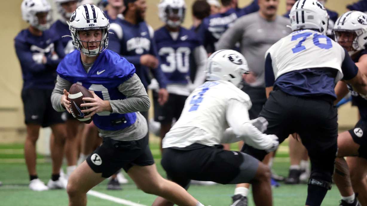 BYU quarterback Kedon Slovis looks to make a pass during opening day of BYU spring football camp at the BYU Indoor Practice Facility in Provo, on Monday, March 6, 2023.